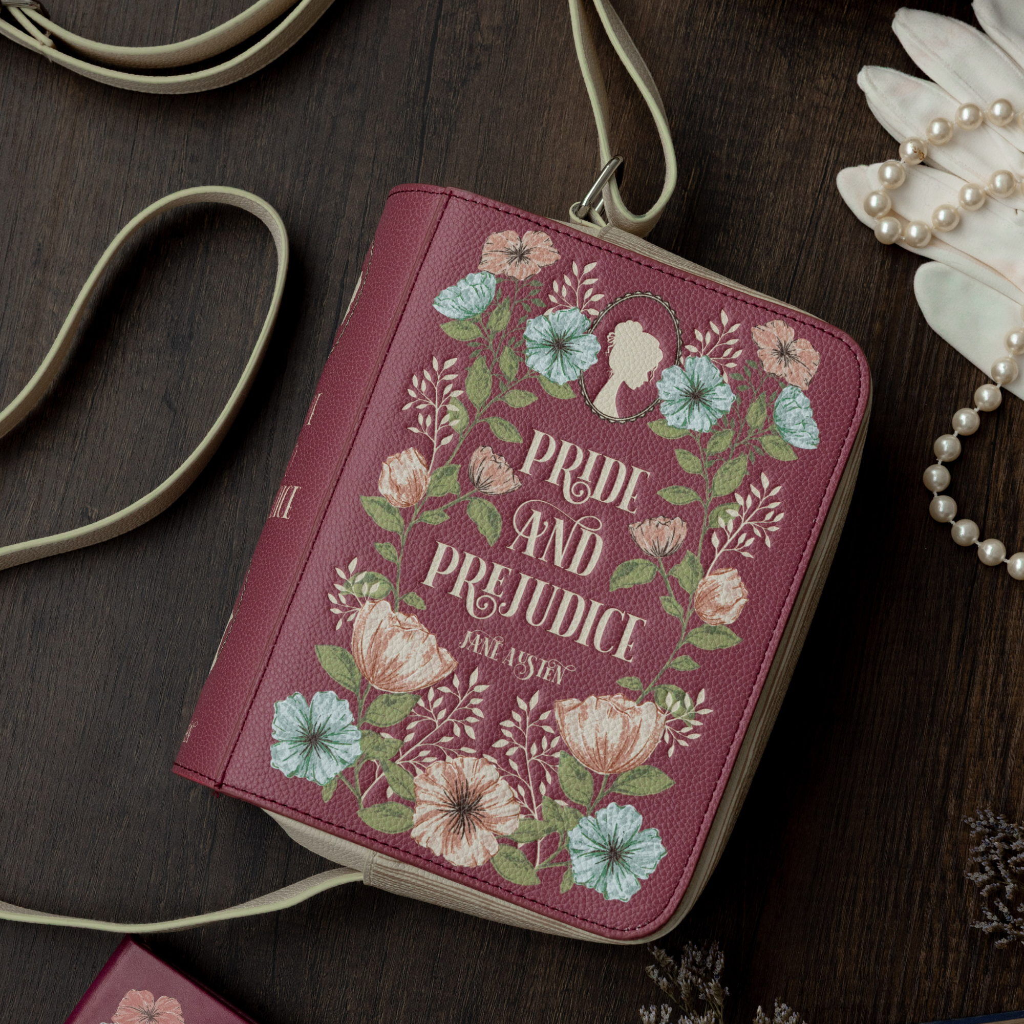 Book-shaped handbag with 'Pride and Prejudice' design on a wooden surface