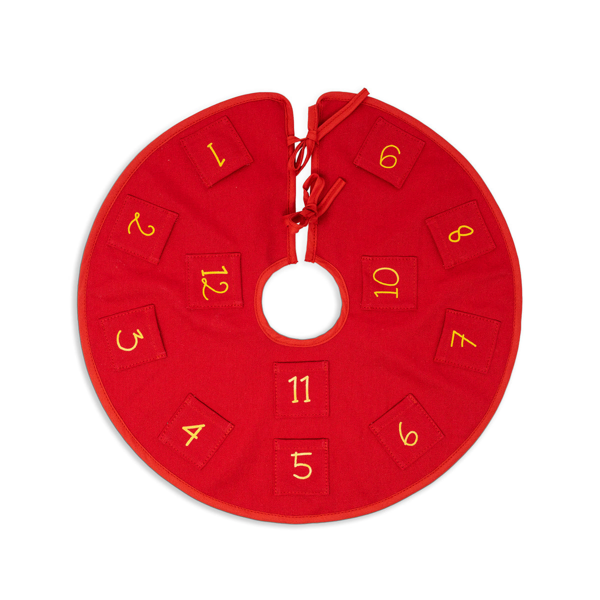 A red circular fabric advent calendar or ornament with numbered square pockets around a central hole, shown on a plain white background.