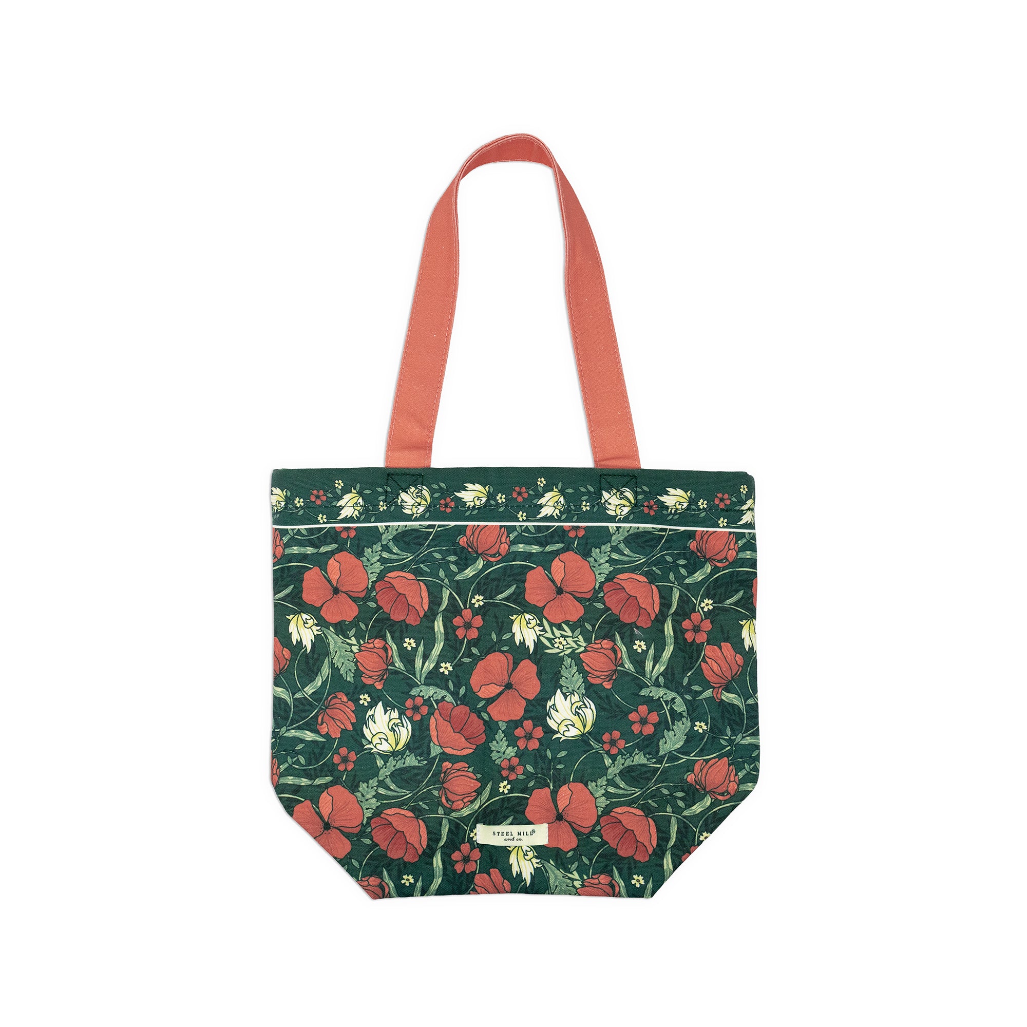 A structured tote bag with a dark green floral print featuring red poppies and white flowers, accented by coral-pink shoulder straps and a small gold brand label at the bottom.