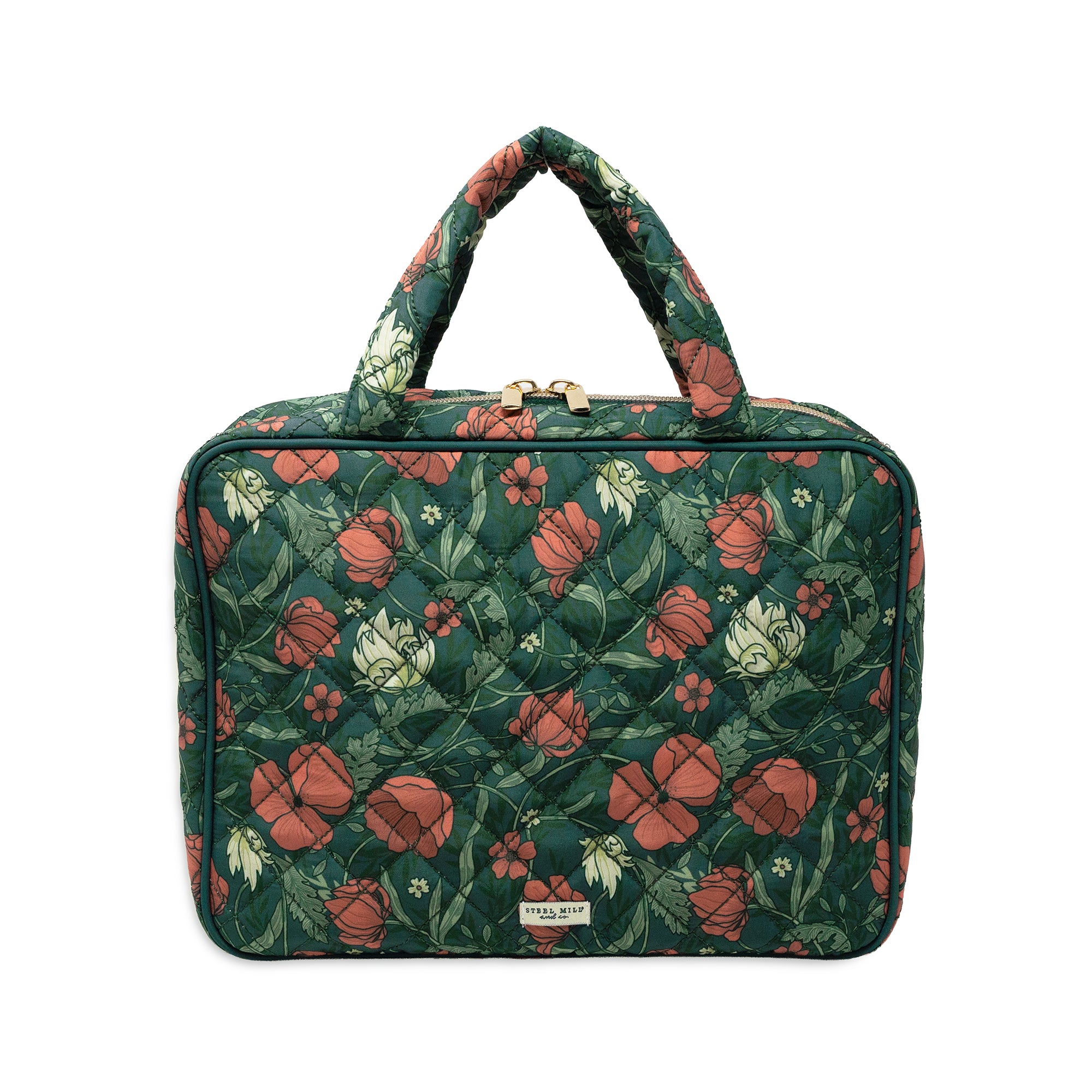 A quilted rectangular handbag with a floral pattern in dark green, terracotta red, and cream, featuring two top handles and a small metal brand plaque at the bottom.