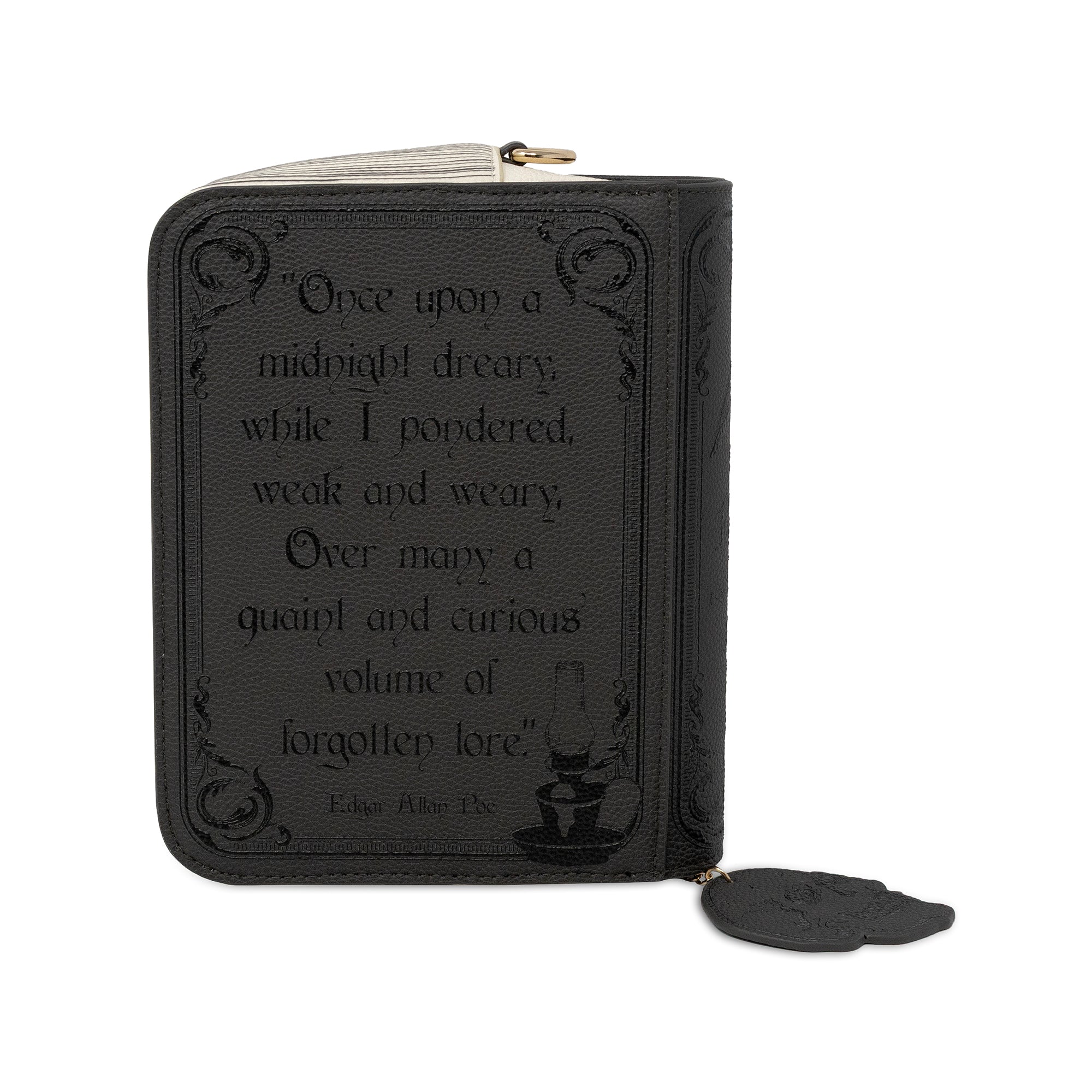 A black zippered crpssbpdyt styled like a book cover, featuring an embossed quote from Edgar Allan Poe and a small black wax seal charm, shown on a white background.