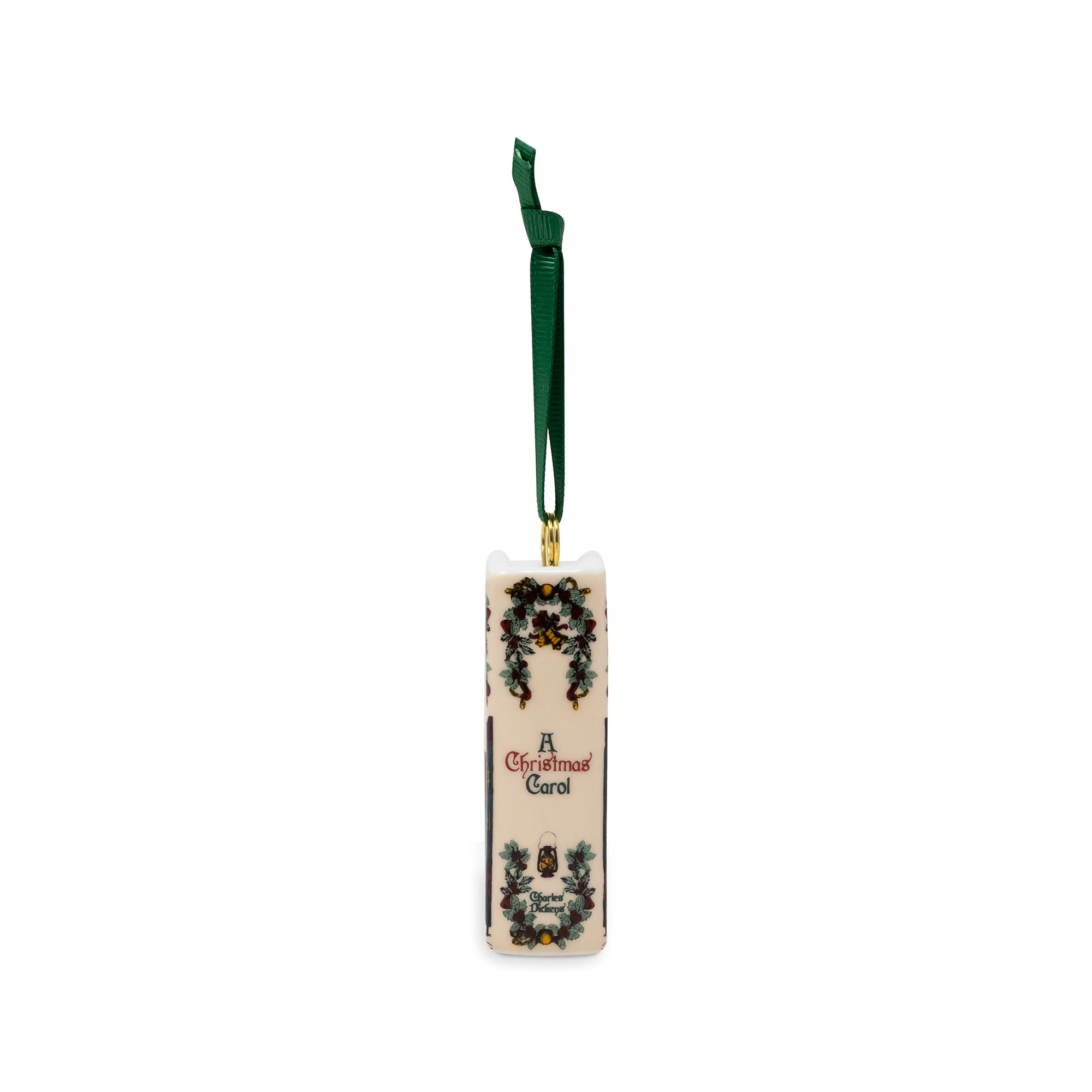 A Christmas ornament shaped like a wine bottle with a dark green hanging ribbon, featuring 'A Christmas Carol' text and decorative illustrations on a white background.