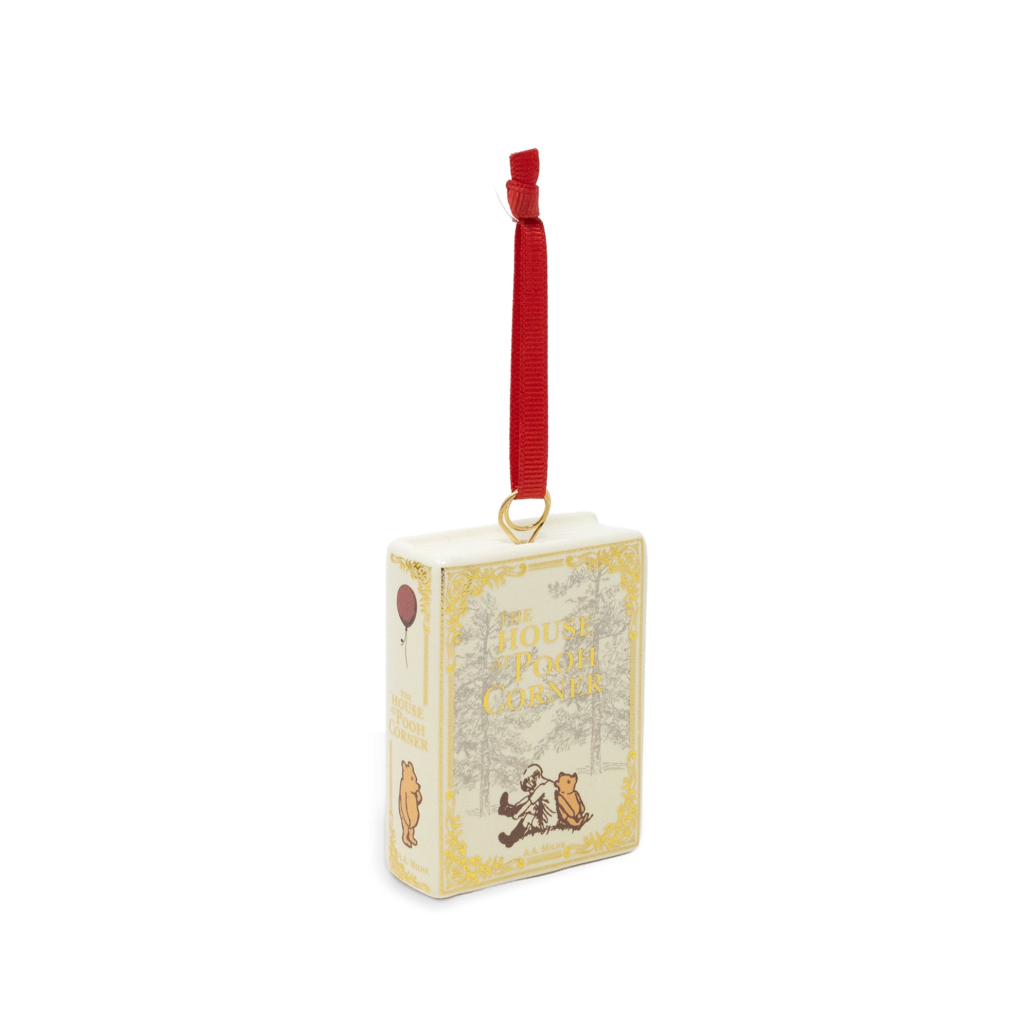 A Disney Winnie the Pooh book-shaped ornament with a red hanging ribbon and gold ring, shown on a plain white background.