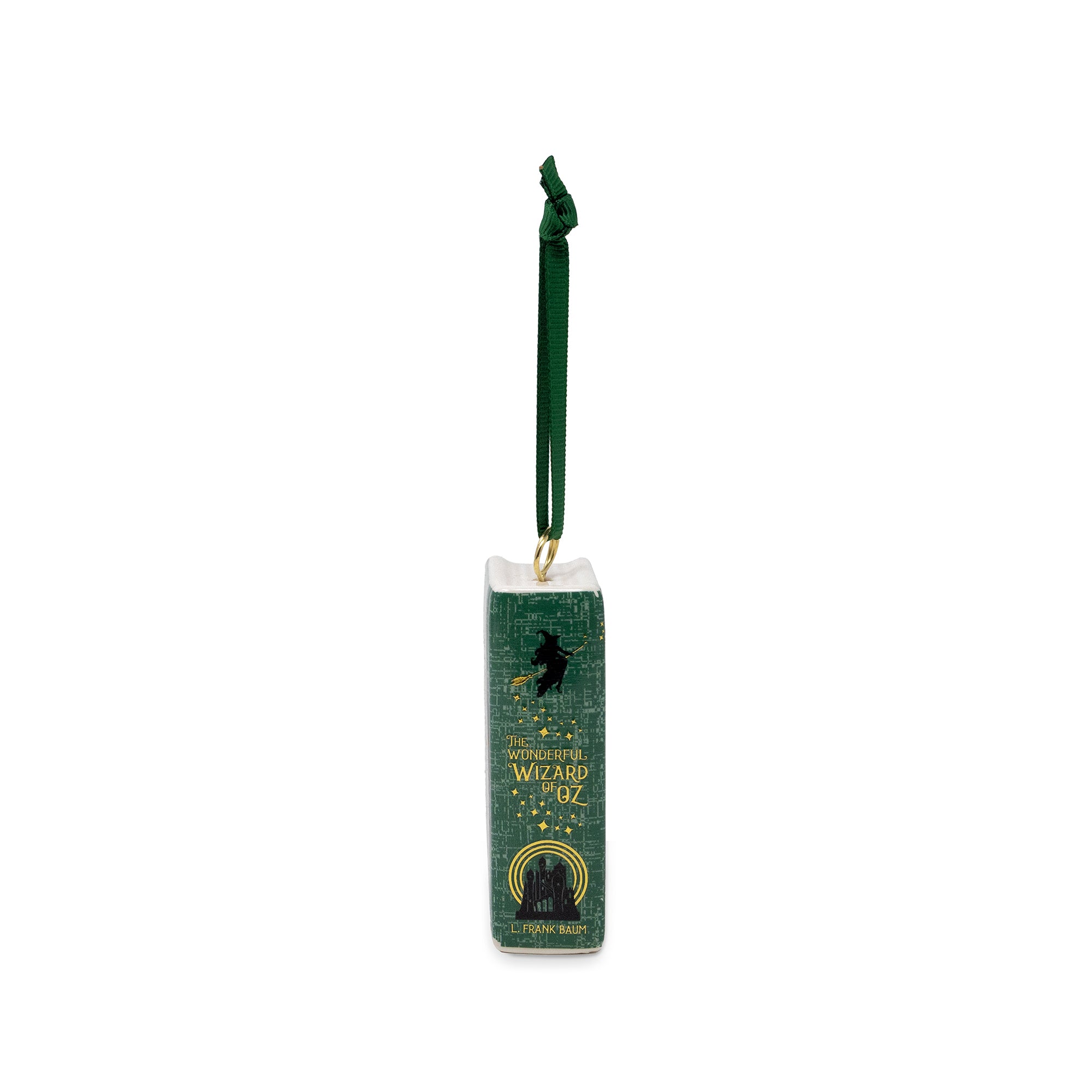 A green book-shaped Christmas ornament featuring 'The Wizard of Oz' design, complete with a hanging green ribbon and gold lettering, shown against a plain white background.