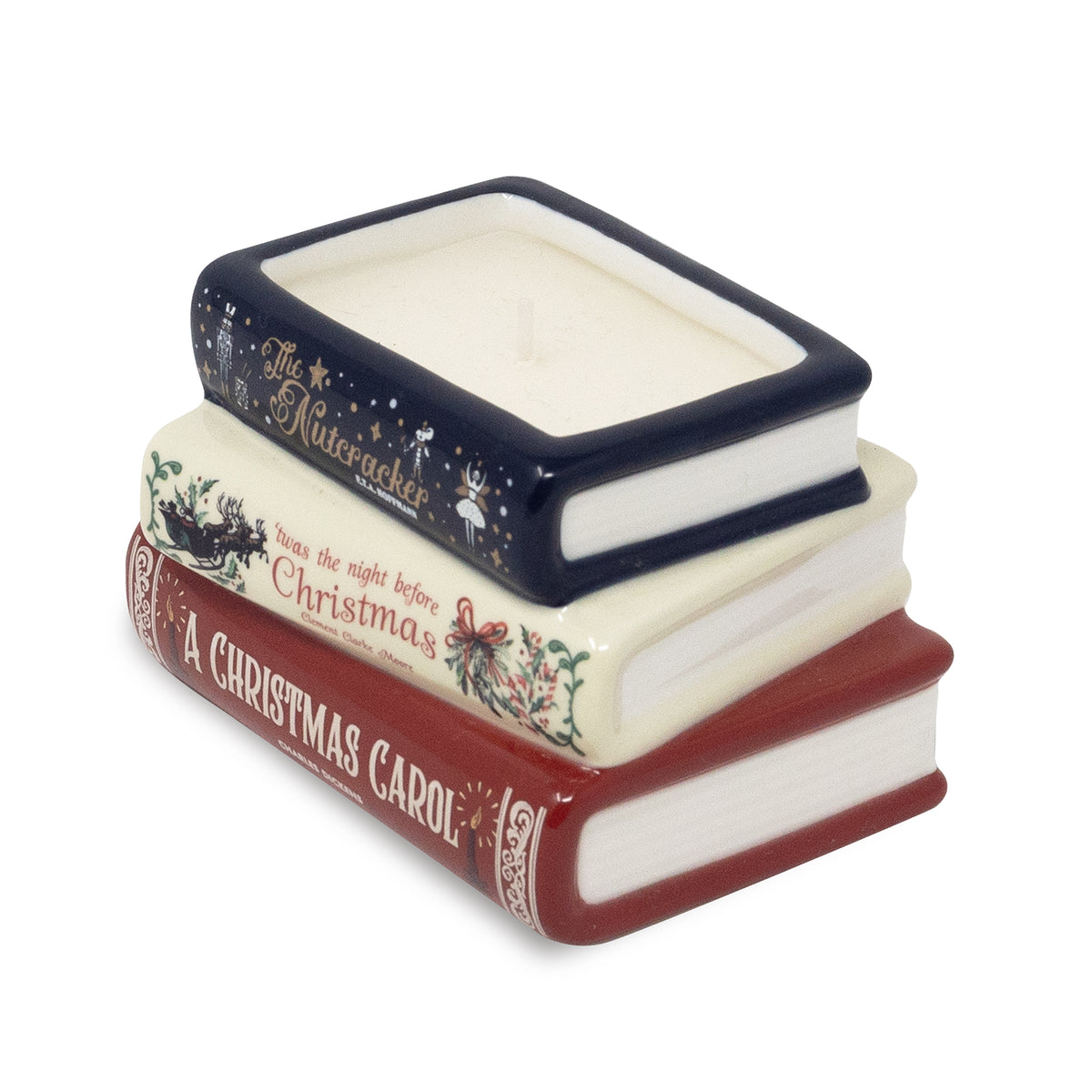 A Christmas-themed book stack candle holder featuring three stacked books: 'A Christmas Carol' in red, 'The Nutcracker' in navy blue with gold lettering, and 'Snow White' in cream with holiday illustrations. The top book is open to reveal a white wax candle inside.
