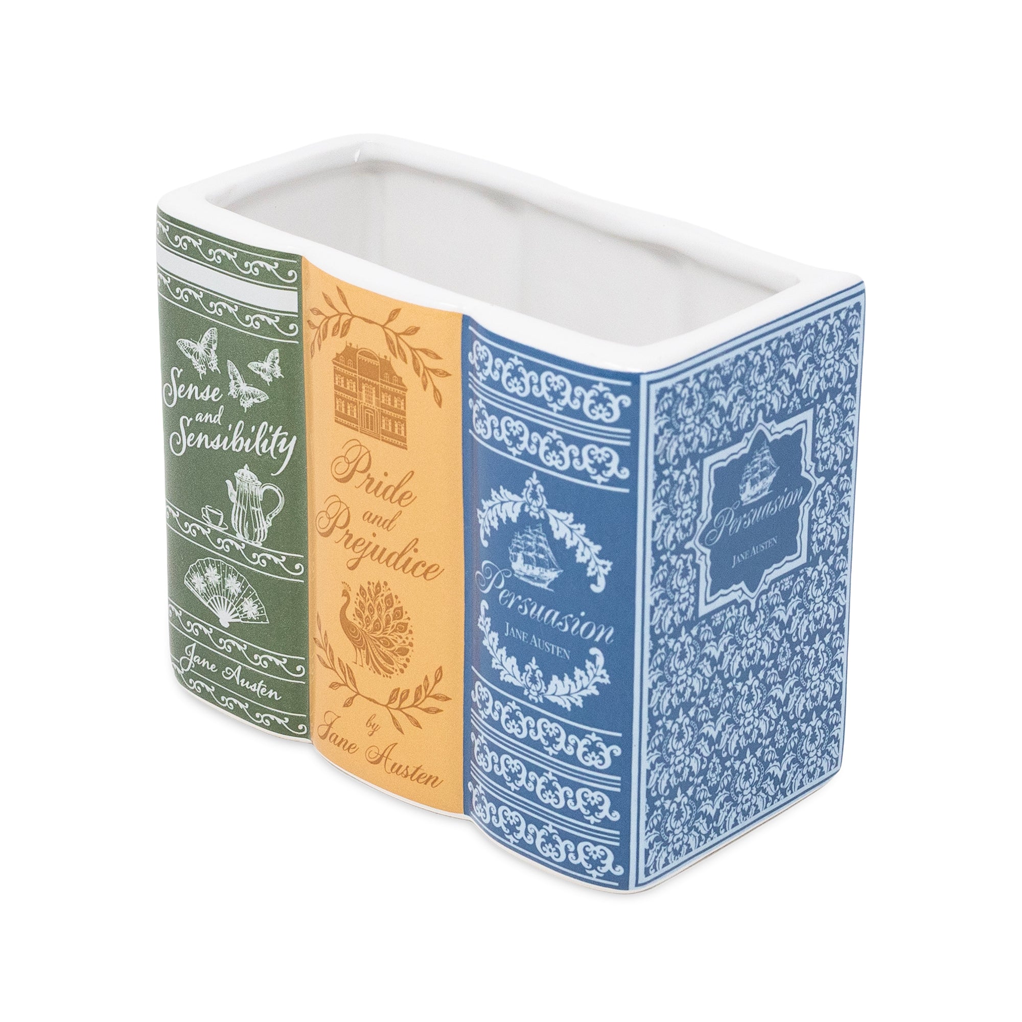 A rectangular ceramic container designed to look like three vintage book covers standing upright side by side. 