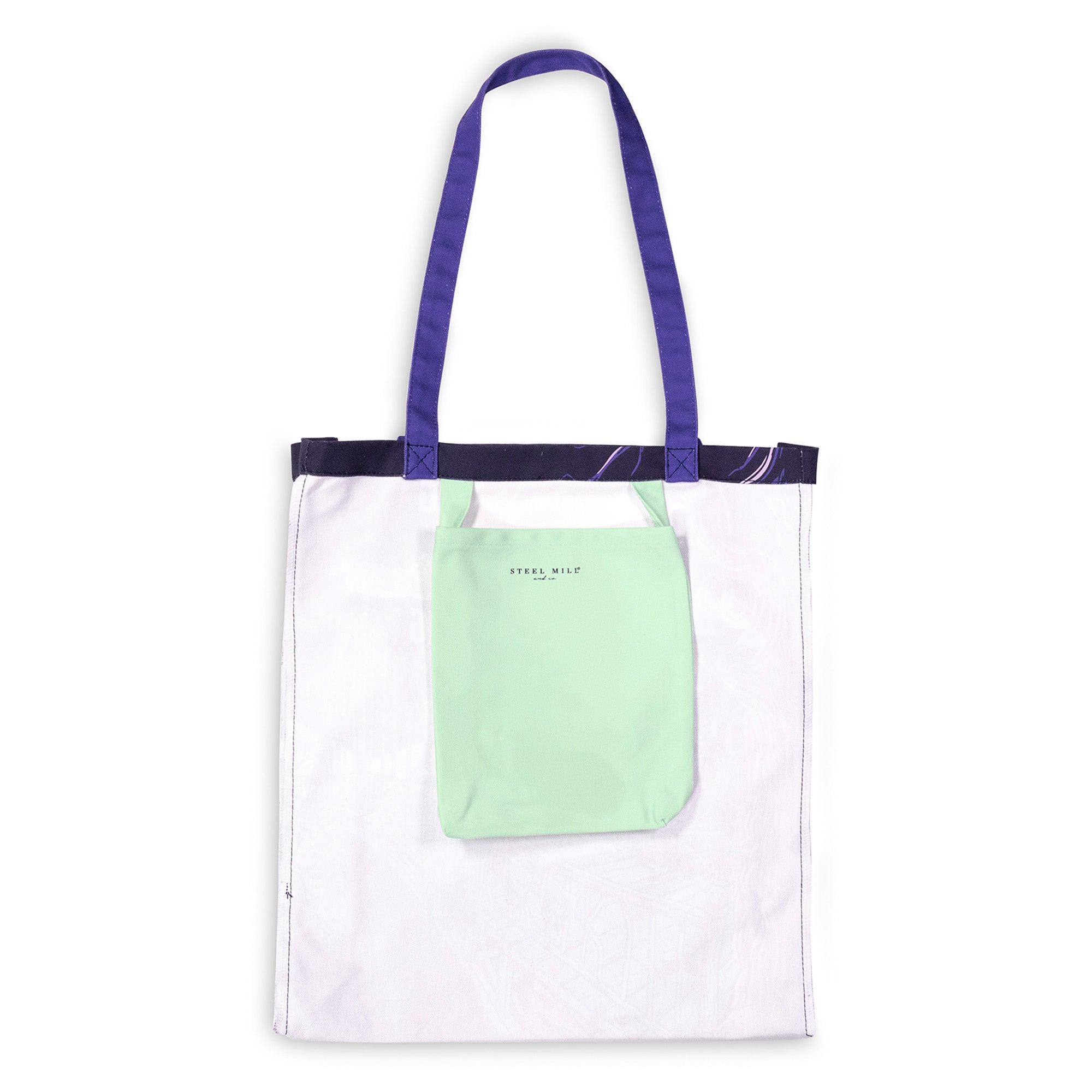 A white canvas tote bag with purple shoulder straps and a dark purple top trim, featuring a mint green front pocket