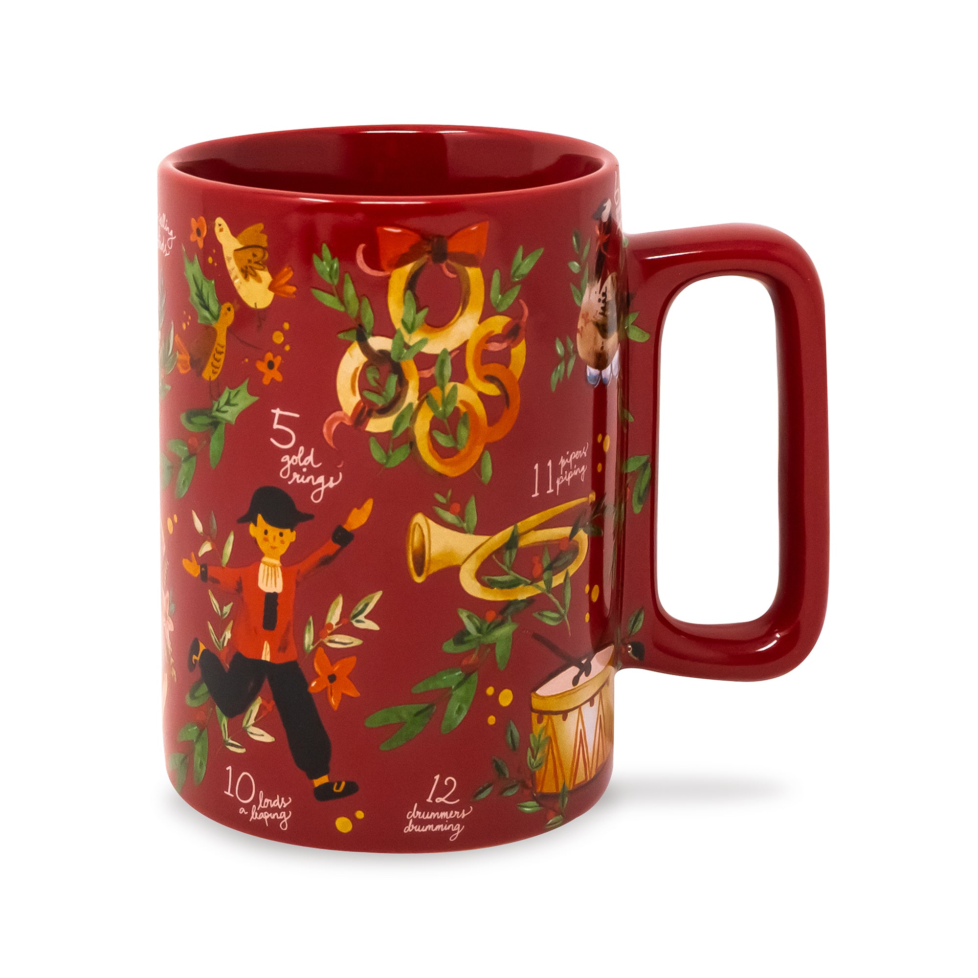 A red ceramic mug with a glossy finish, decorated with festive illustrations of a marching band, musical instruments, and Christmas wreaths on a white background.