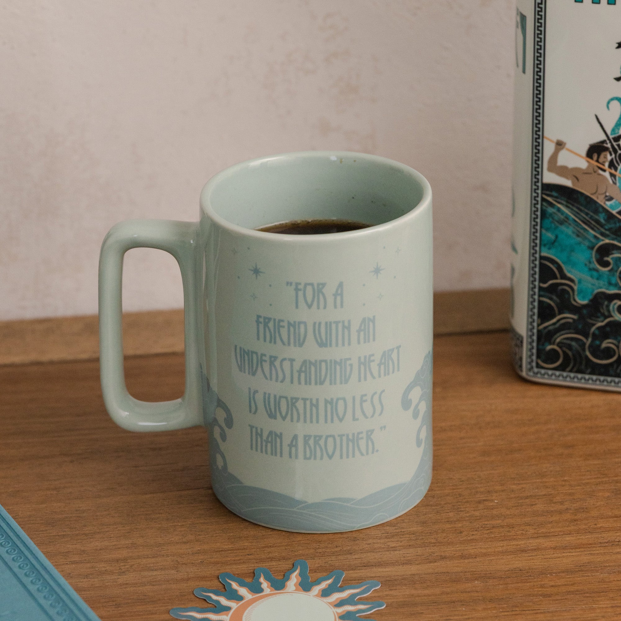 Teal mug with 'for a friend with an understanding heart is worth no less than a brother' quote on the back