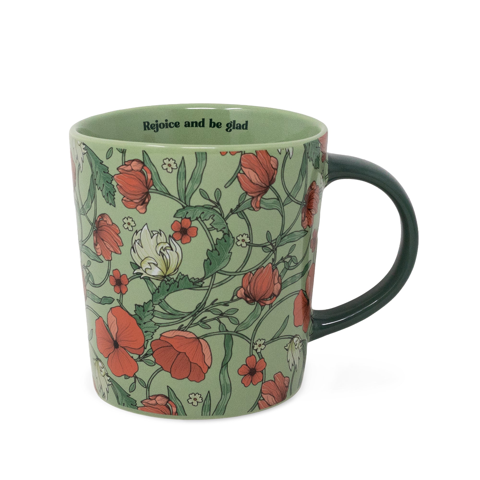 A ceramic mug featuring a light sage green background decorated with a red poppy and white flower botanical pattern, complete with a dark green handle and the printed text 'Rejoice and be glad' inside the rim.