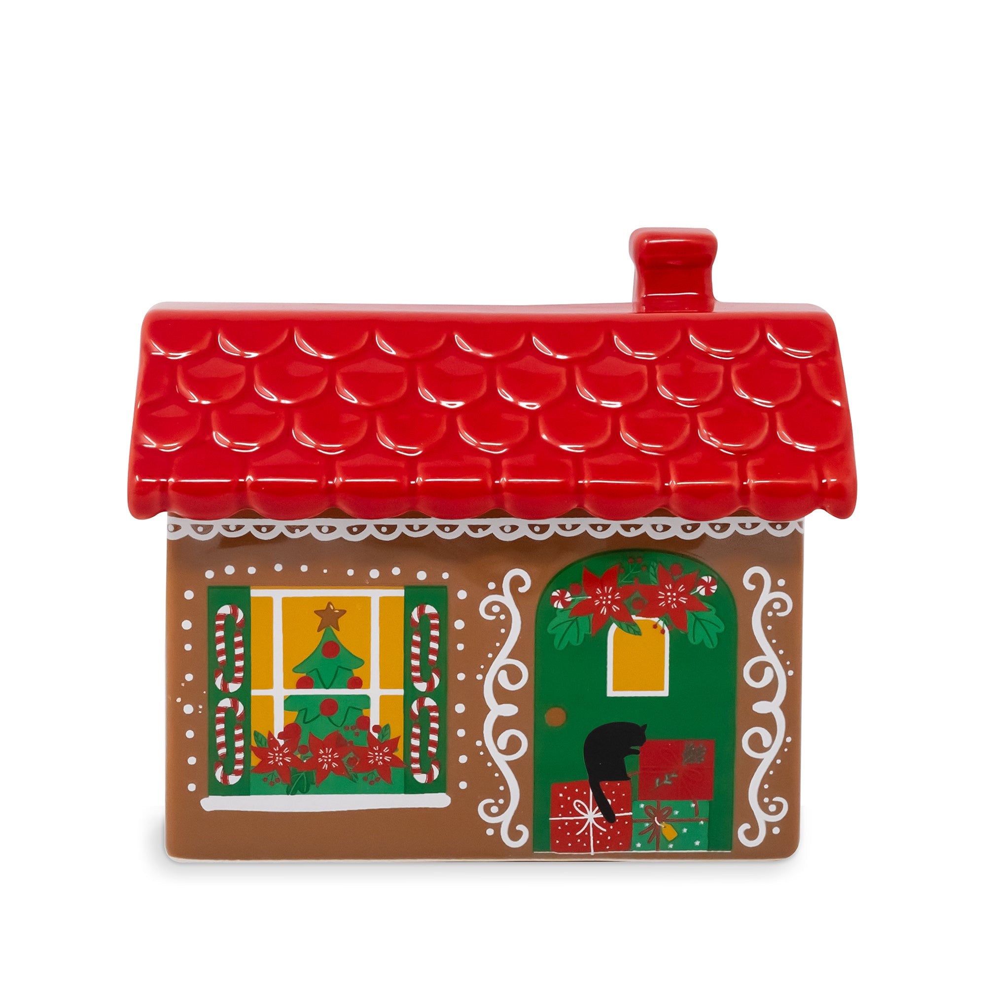 A gingerbread house-shaped ceramic container or cookie dish with a red scalloped roof, brown body, green door, and festive holiday decorations, shown on a plain white background.