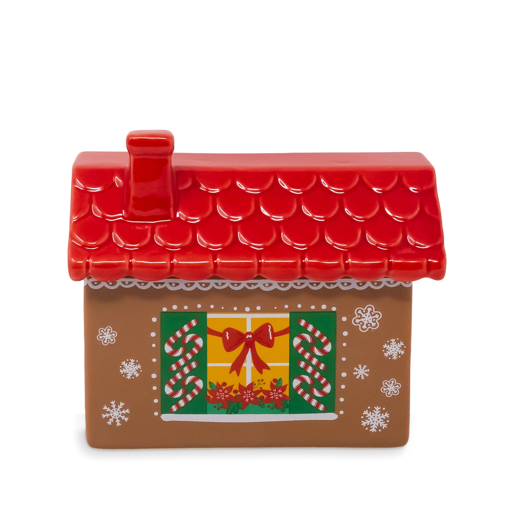 A gingerbread house shaped holiday cookie jar with a red scalloped roof, a green window with a red bow, candy canes, and white snowflake details on a white background.