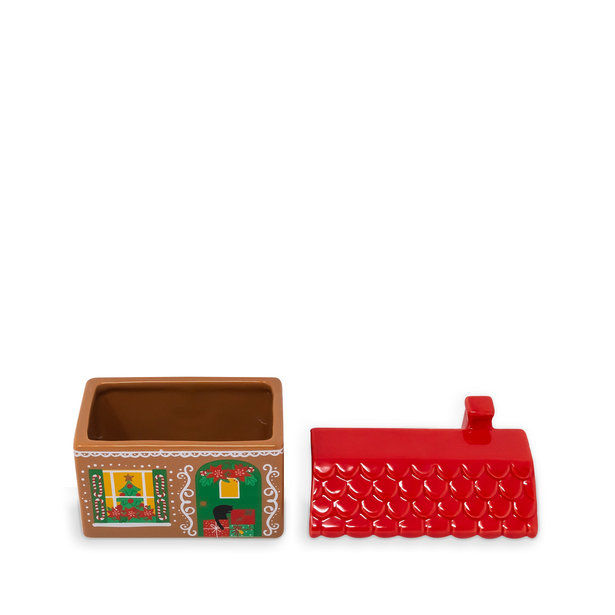 A small decorative ceramic box with a red house-shaped lid and a brown interior, shown on a plain white background. The front of the box has colorful illustrated details including green, yellow, and white patterns.