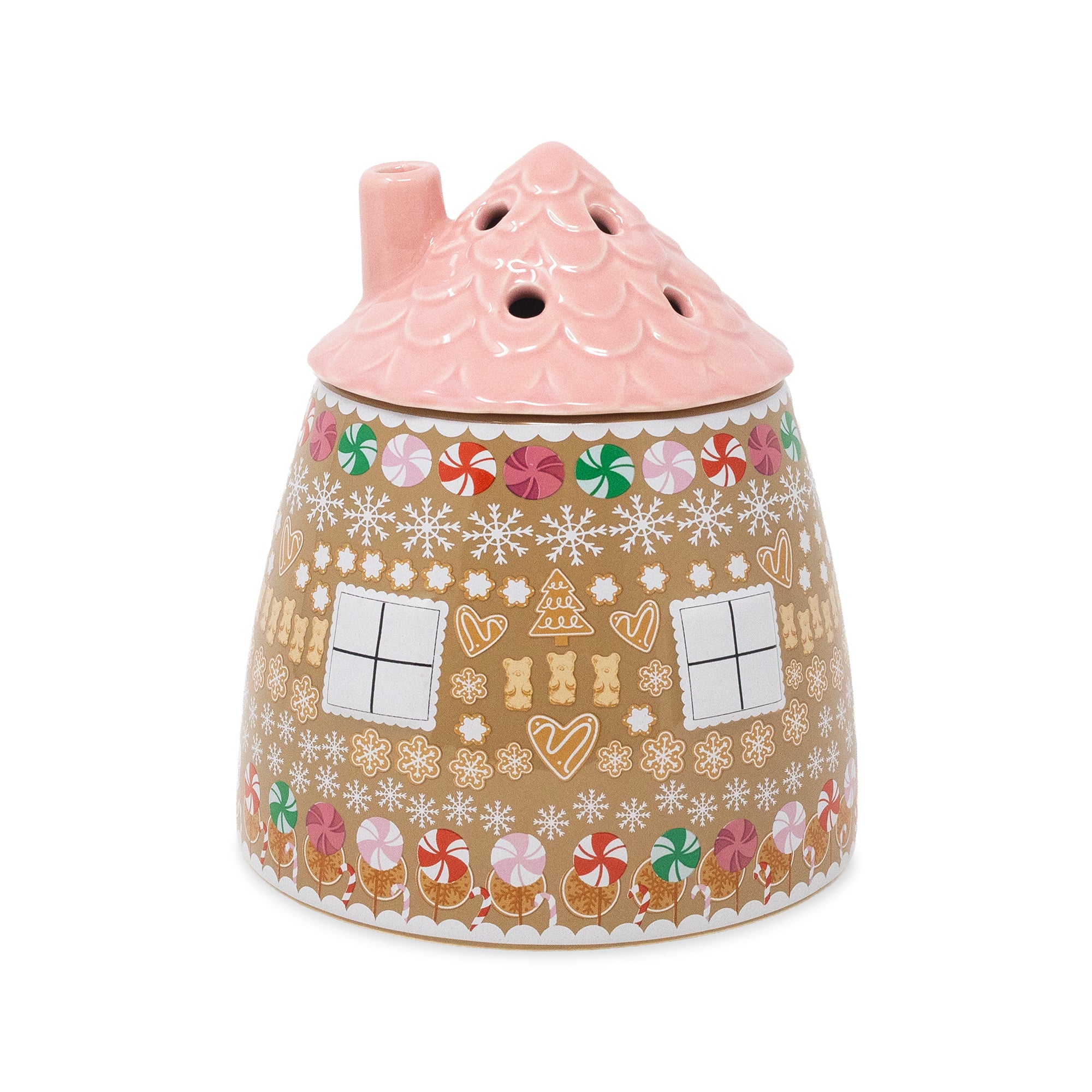 A ceramic gingerbread house-shaped vase with a pink roof and a decorated body featuring gingerbread cookies, candy canes, snowflakes, and windows on a white background.