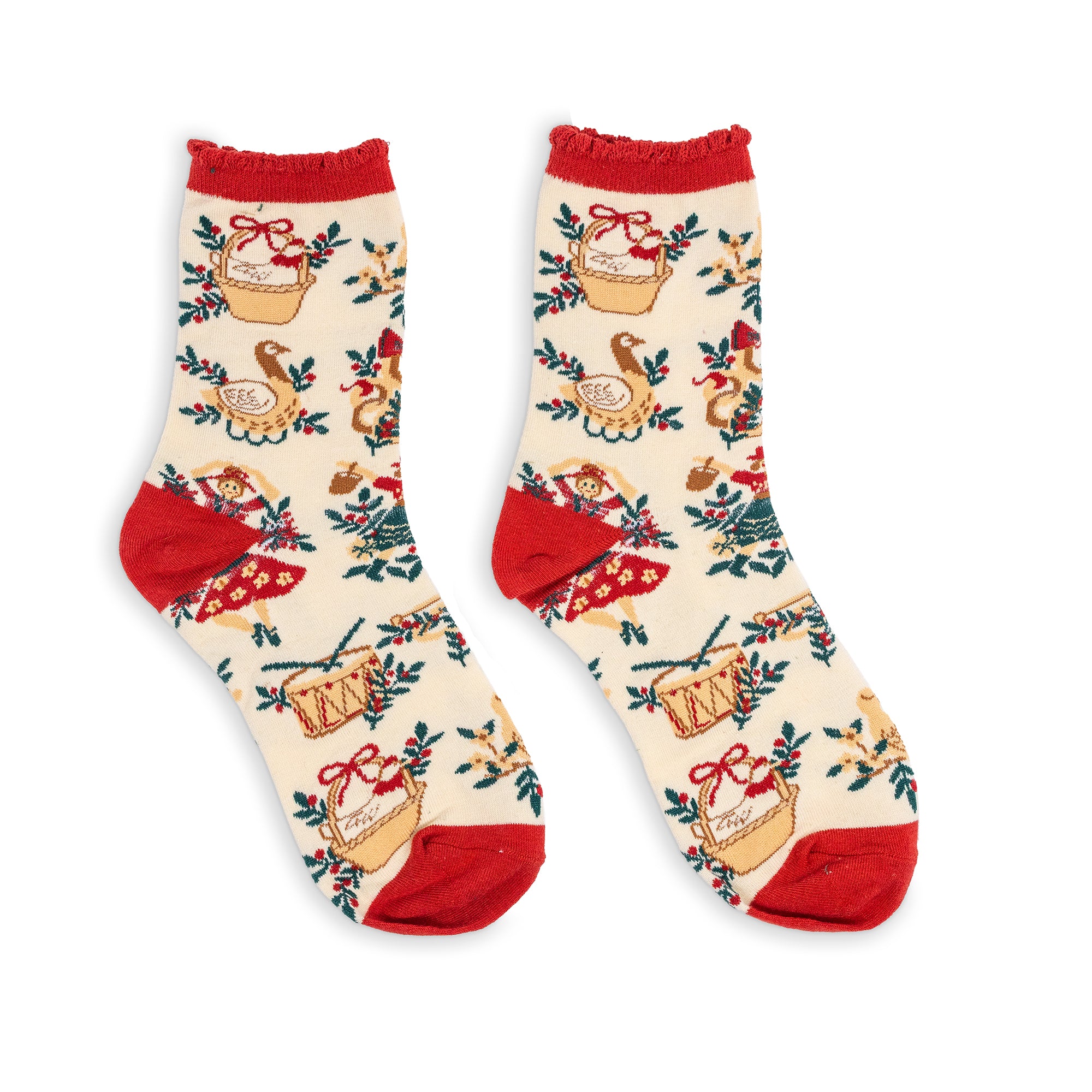 A pair of cream-colored crew socks with a festive holiday print featuring red cuffs, heels, and toes, decorated with illustrations of baskets, turkeys, and evergreen trees.