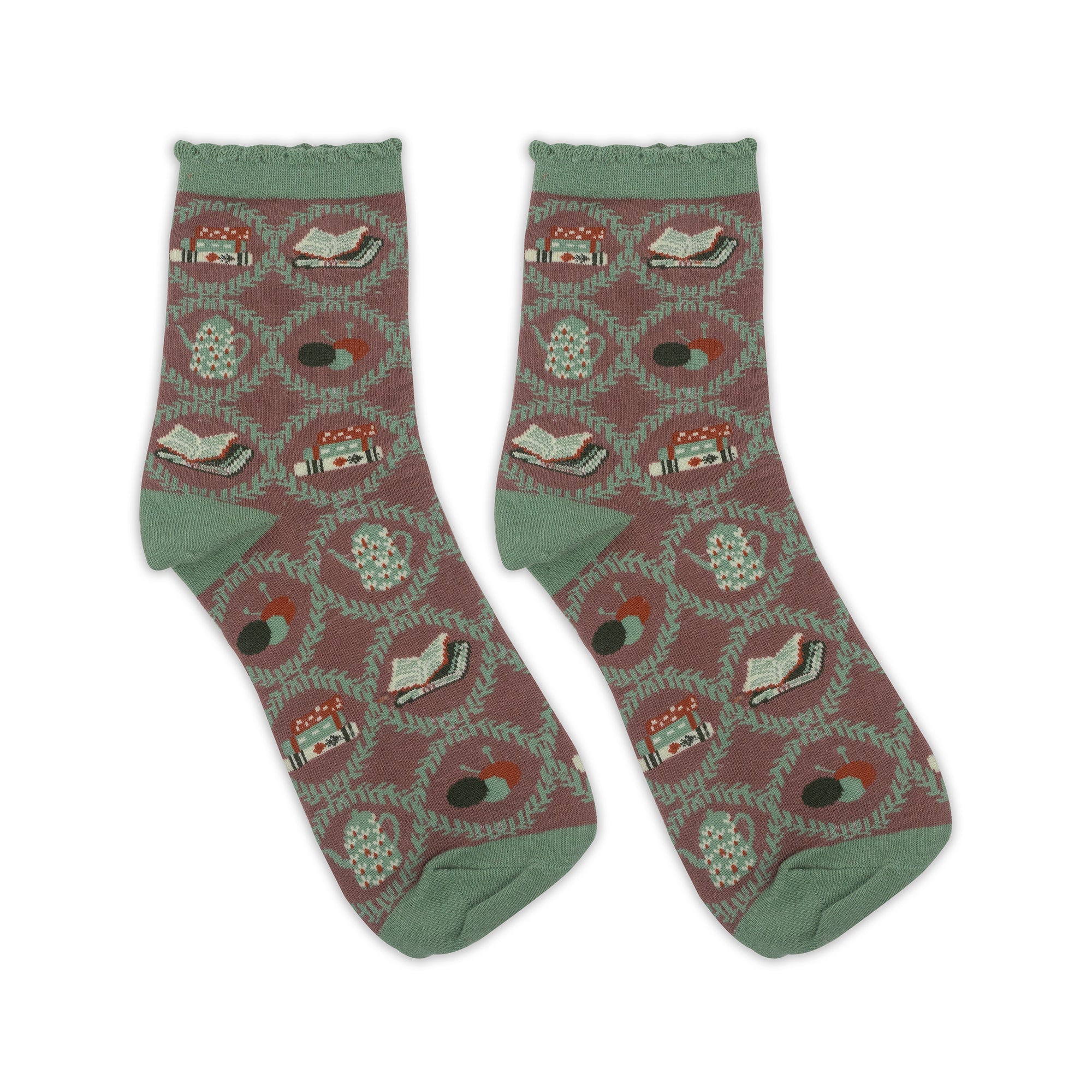 Pair of socks with a pattern of books and teapots on a white background