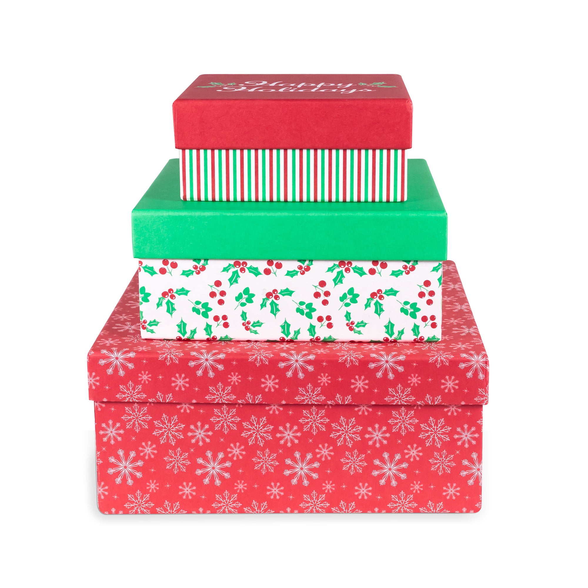 A stack of four stacked Christmas gift boxes with festive holiday patterns, including snowflakes, holly, stripes, and a red lid with white cursive text, isolated on a white background.