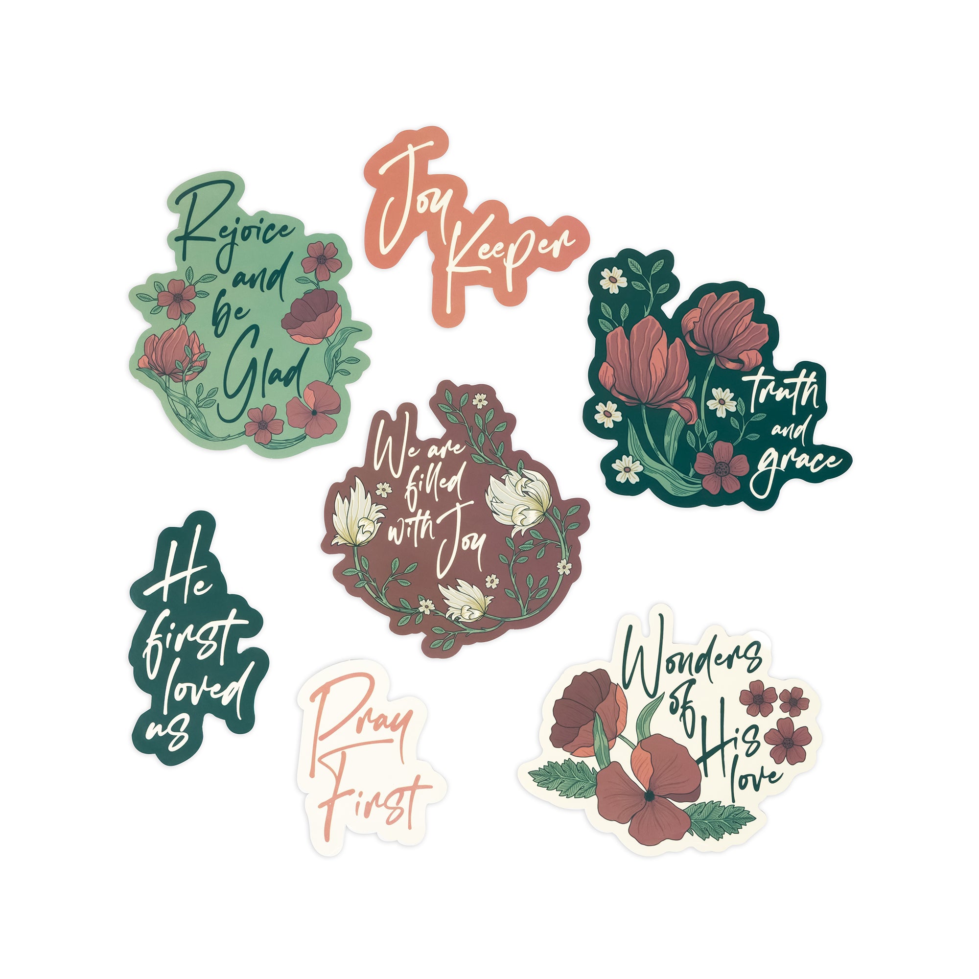 Seven decorative die-cut stickers with inspirational religious phrases and floral illustrations, arranged on a plain white background.