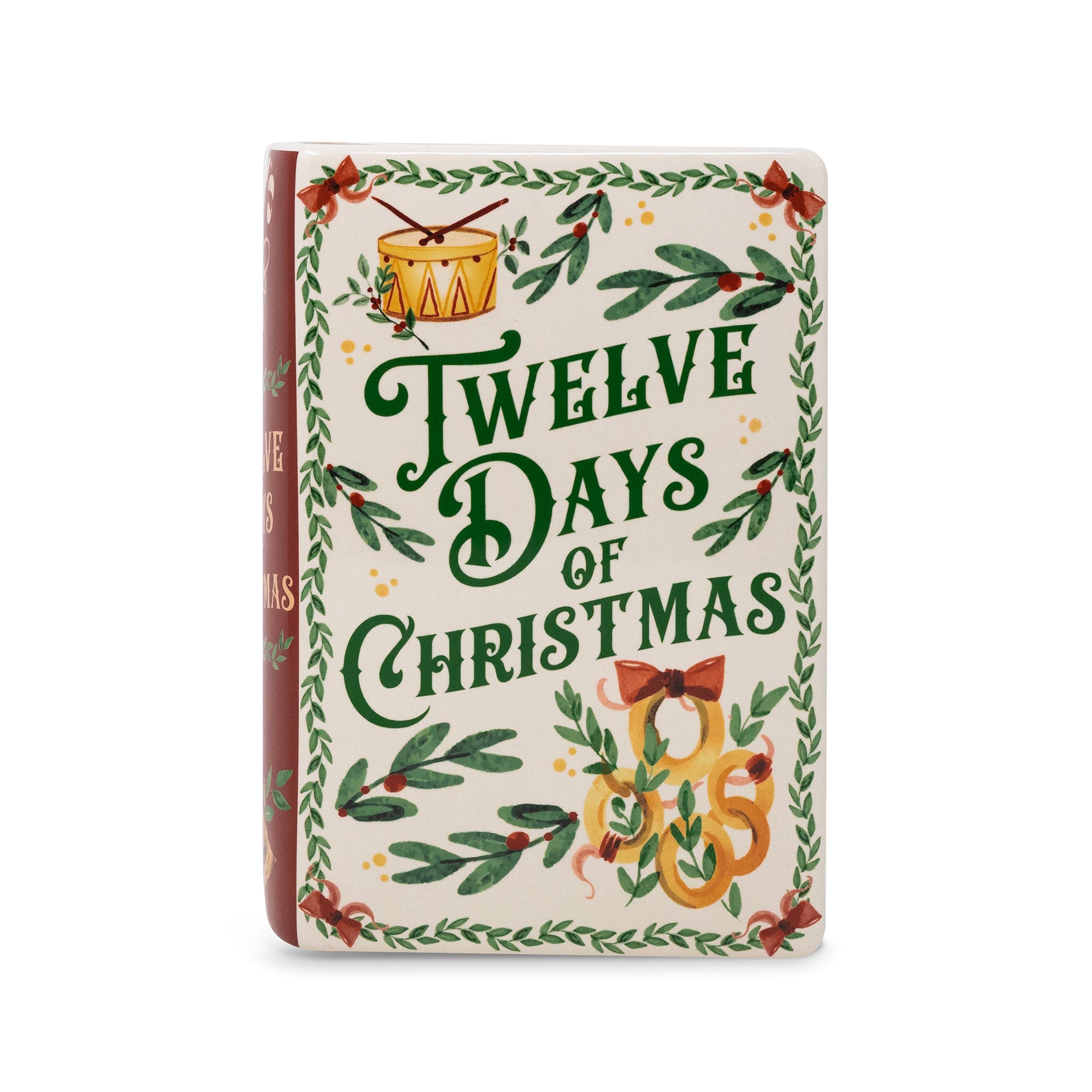 vase featuring a festive Christmas cover design with the title 'Twelve Days of Christmas' in dark green script, surrounded by holly leaves, red berries, and gold ornaments on an off-white background.