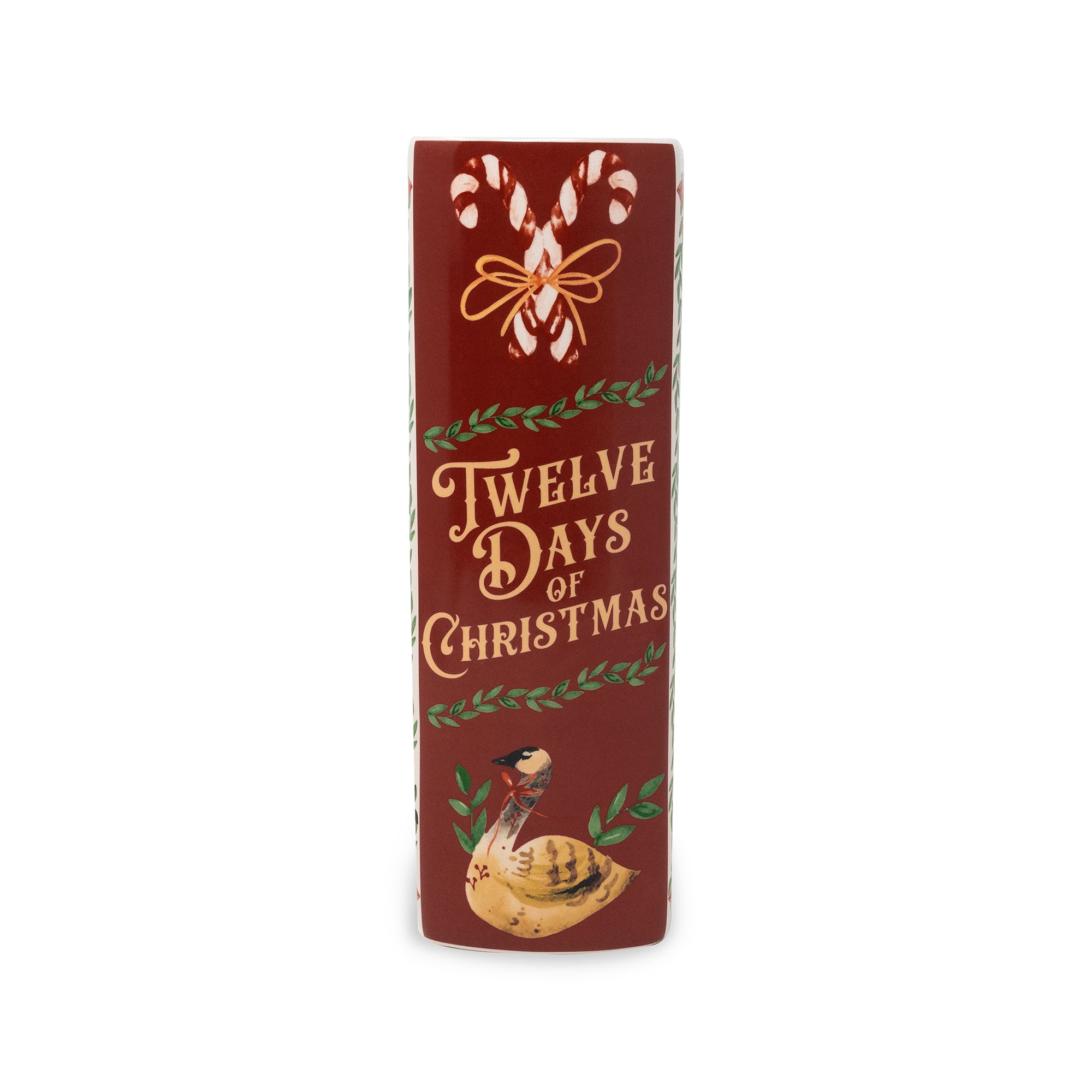 A tall, narrow red decorative vase with the words 'Twelve Days of Christmas' in gold lettering, decorated with white candy canes, green wreath motifs, and a turkey illustration near the bottom, shown on a plain white background.