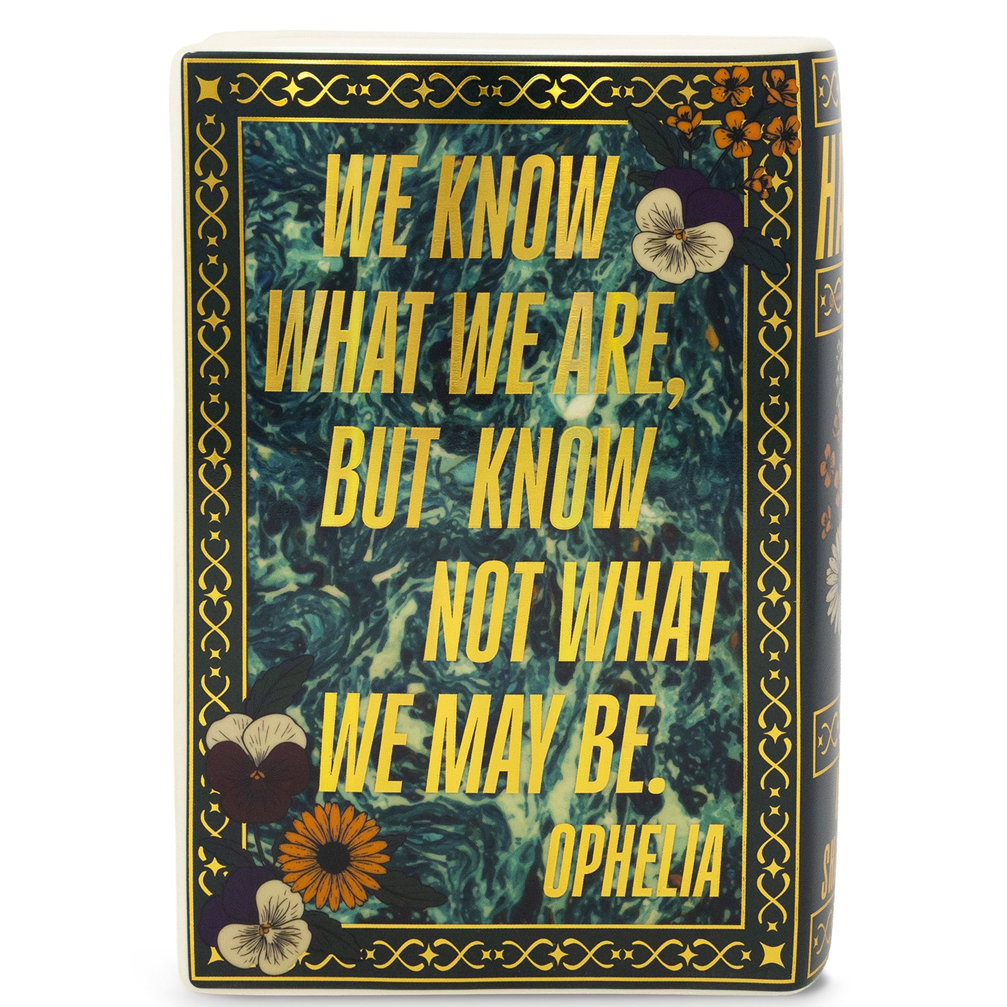 Decorative book vase that says 'we know what we are, but know not what we may be. - Ophelia' on a white background