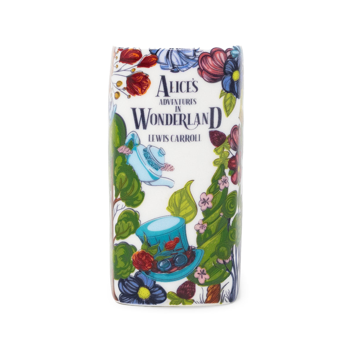A book candle with rounded corners featuring an illustrated Alice in Wonderland design, including the text 'Alice's Adventures in Wonderland' and 'Lewis Carroll,' surrounded by flowers, leaves, a teapot, and a hat on a white background.