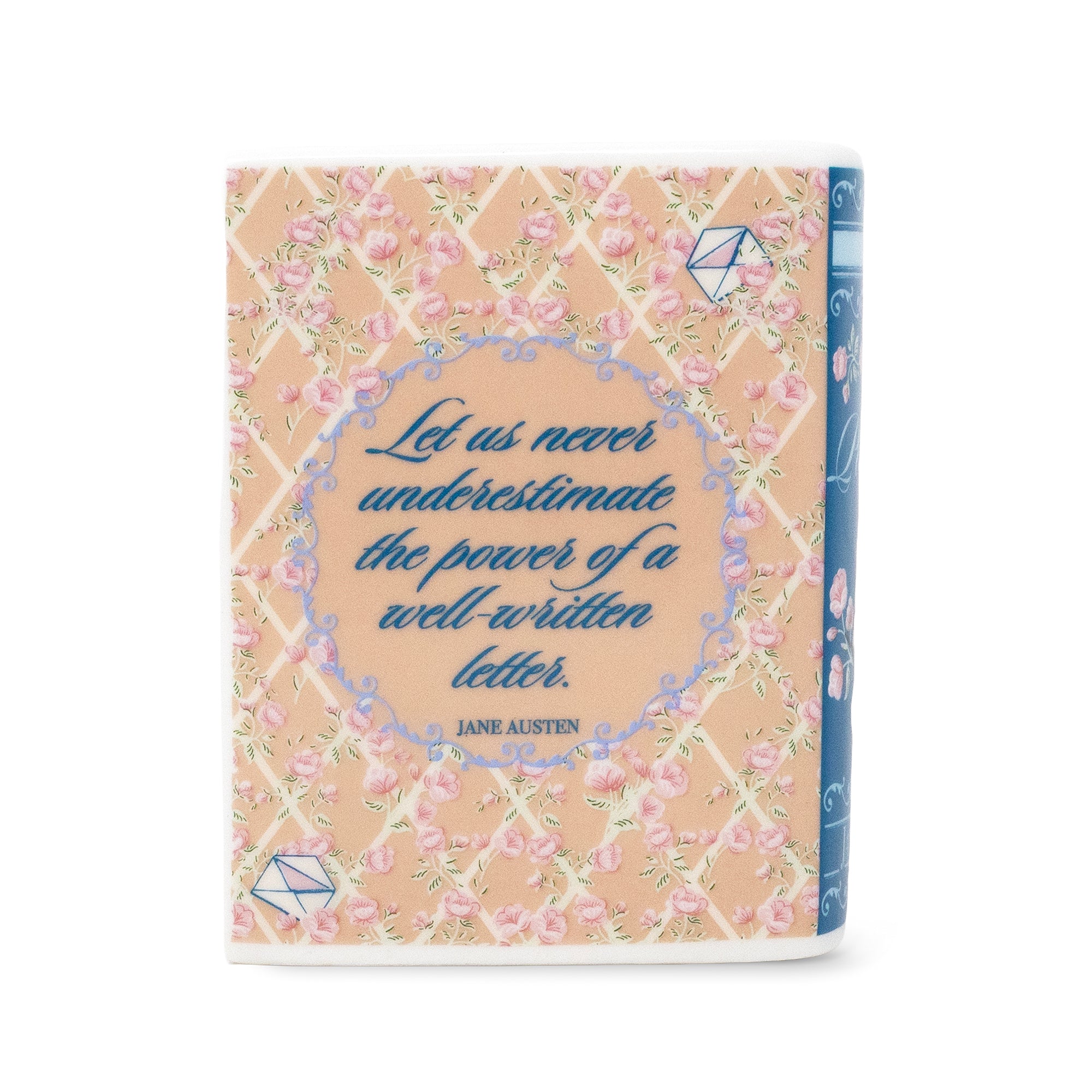 A hardcover book with a peach and pink floral patterned cover, featuring a blue decorative border and the quote 'Let us never underestimate the power of a well-written letter.' by Jane Austen.