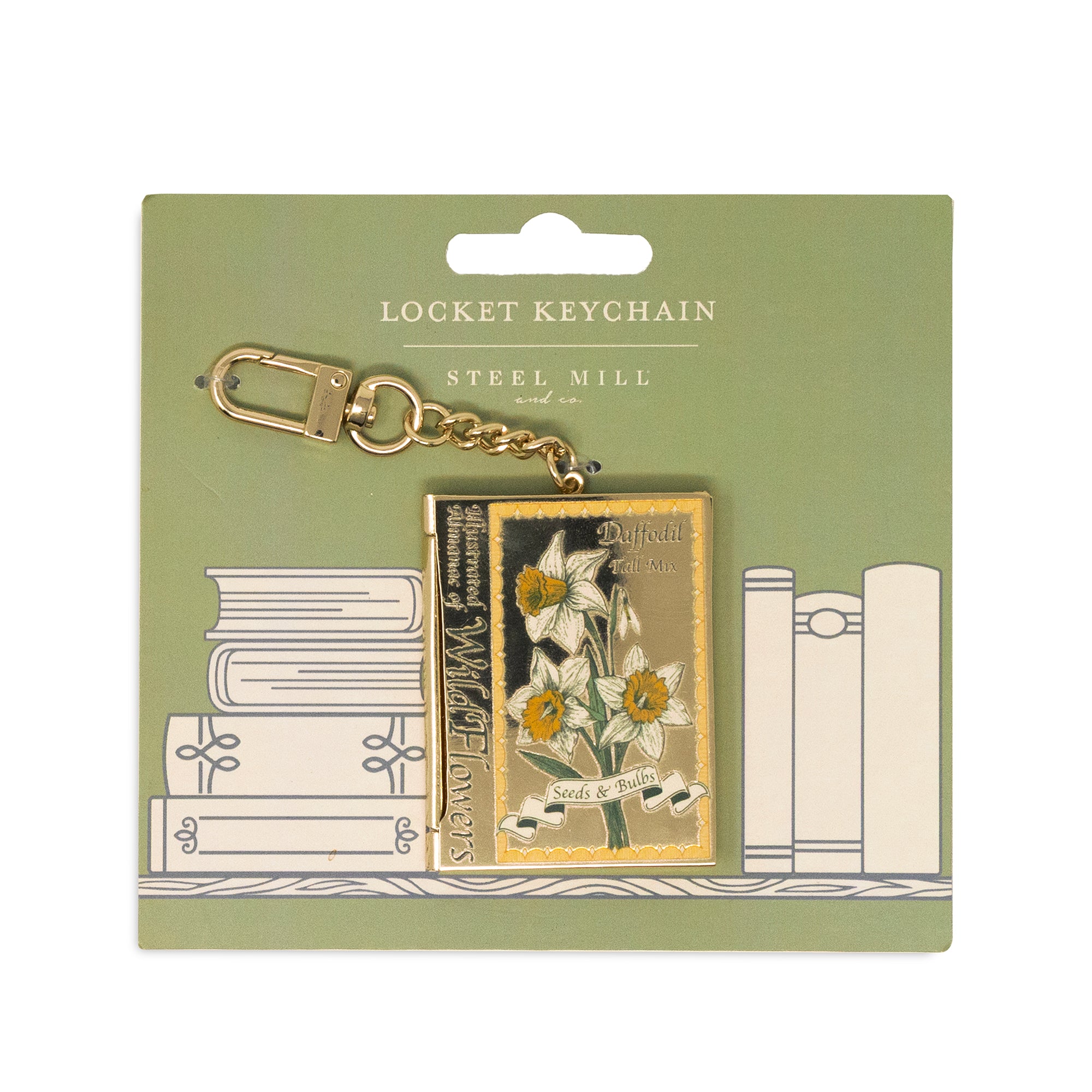 Locket keychain packaging with books and floral design on a green background