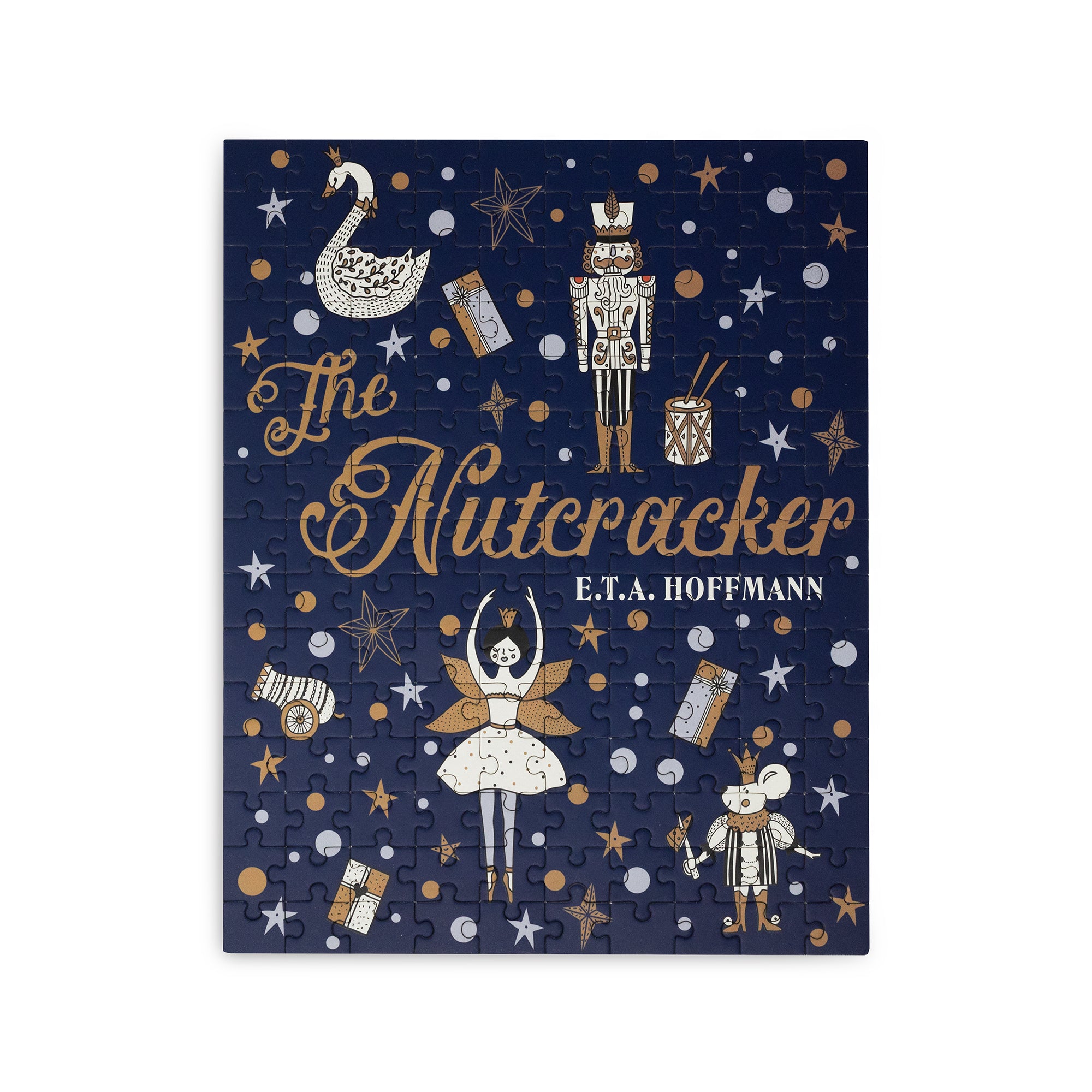 A square jigsaw puzzle featuring a Nutcracker-themed illustration on a dark navy background, with gold, white, and silver stars, swans, nutcracker figures, a ballerina, and the title 'The Nutcracker' by E.T.