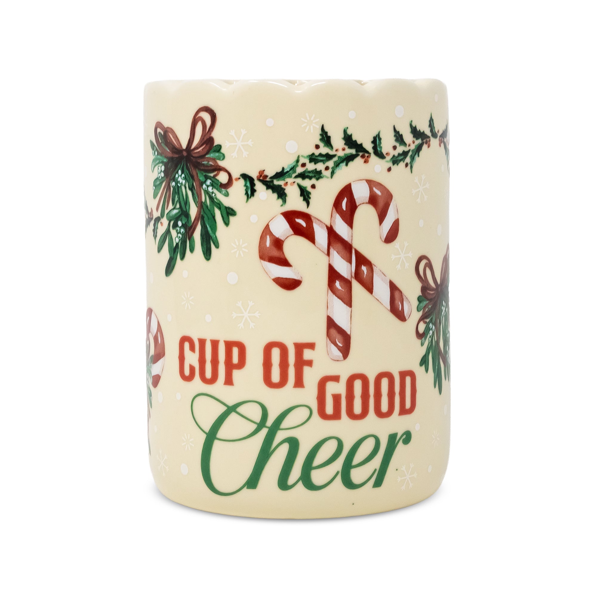 A cylindrical ceramic mug with a cream-colored base, decorated with red and white candy canes, green holly leaves, brown bows, and the text 'CUP OF GOOD Cheer' in red and green lettering.