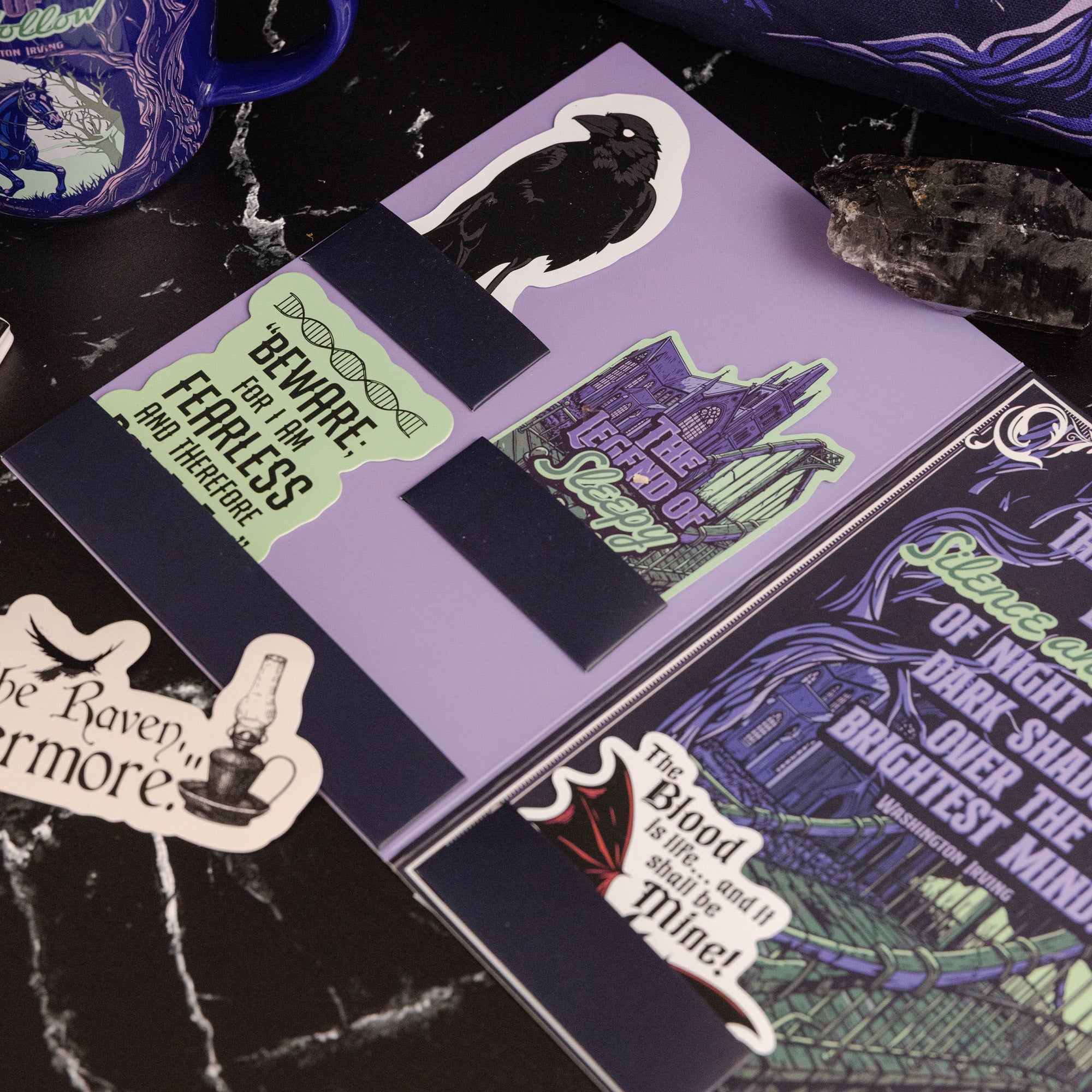 Halloween-themed bookmarks on a dark surface