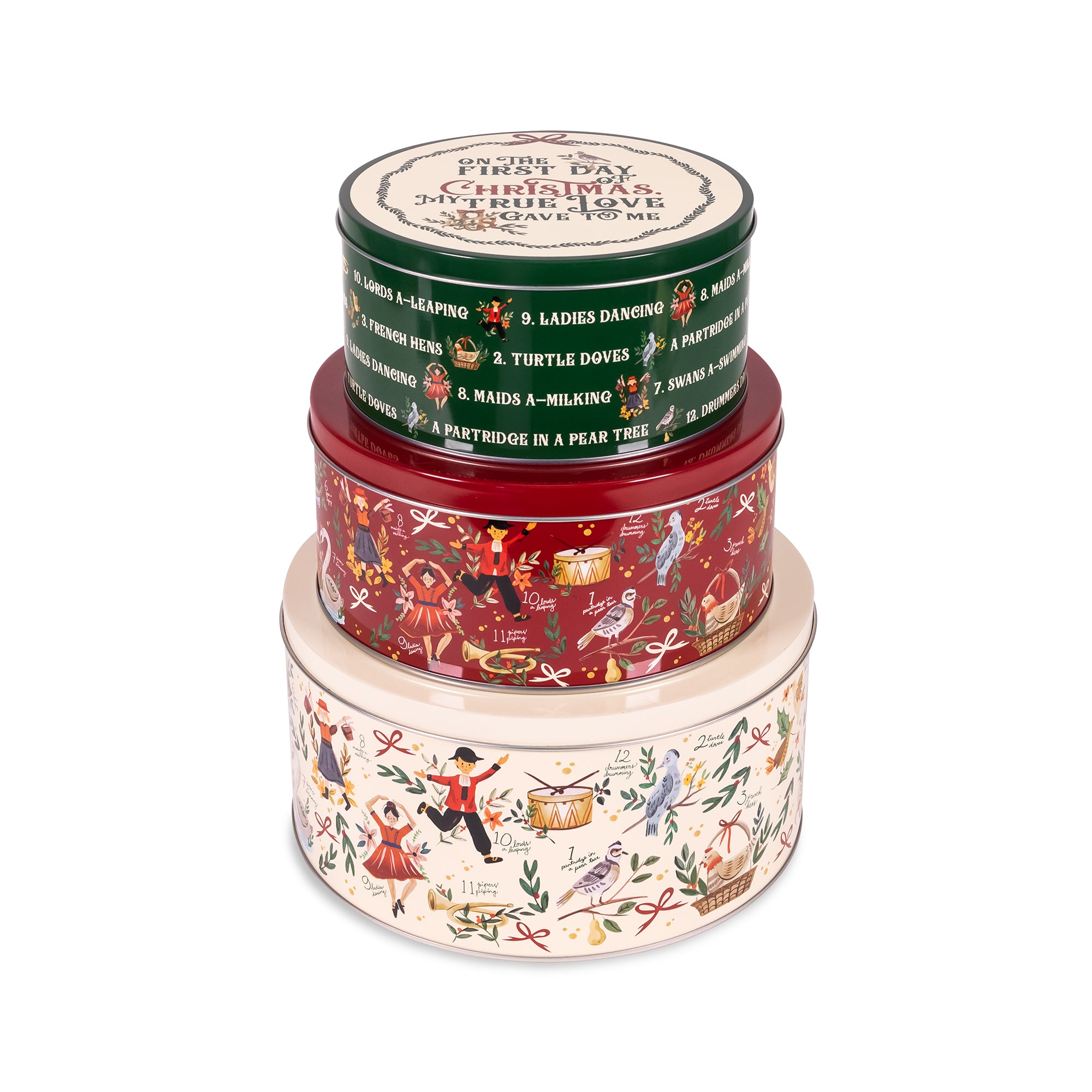 Three stacked round metal tins with Christmas-themed illustrations and text, photographed on a clean white background.