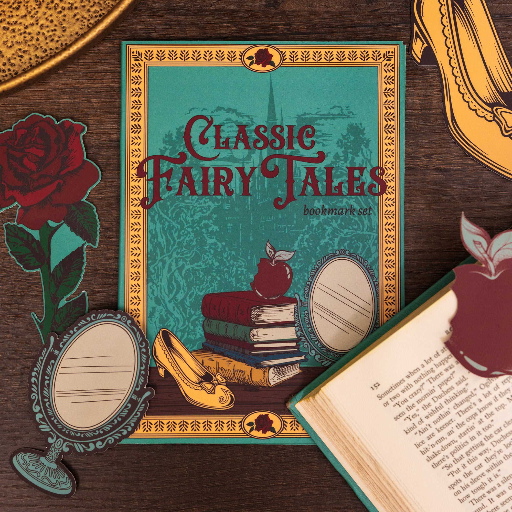 Decorative book cover with rose, mirror, apple and shoe bookmark