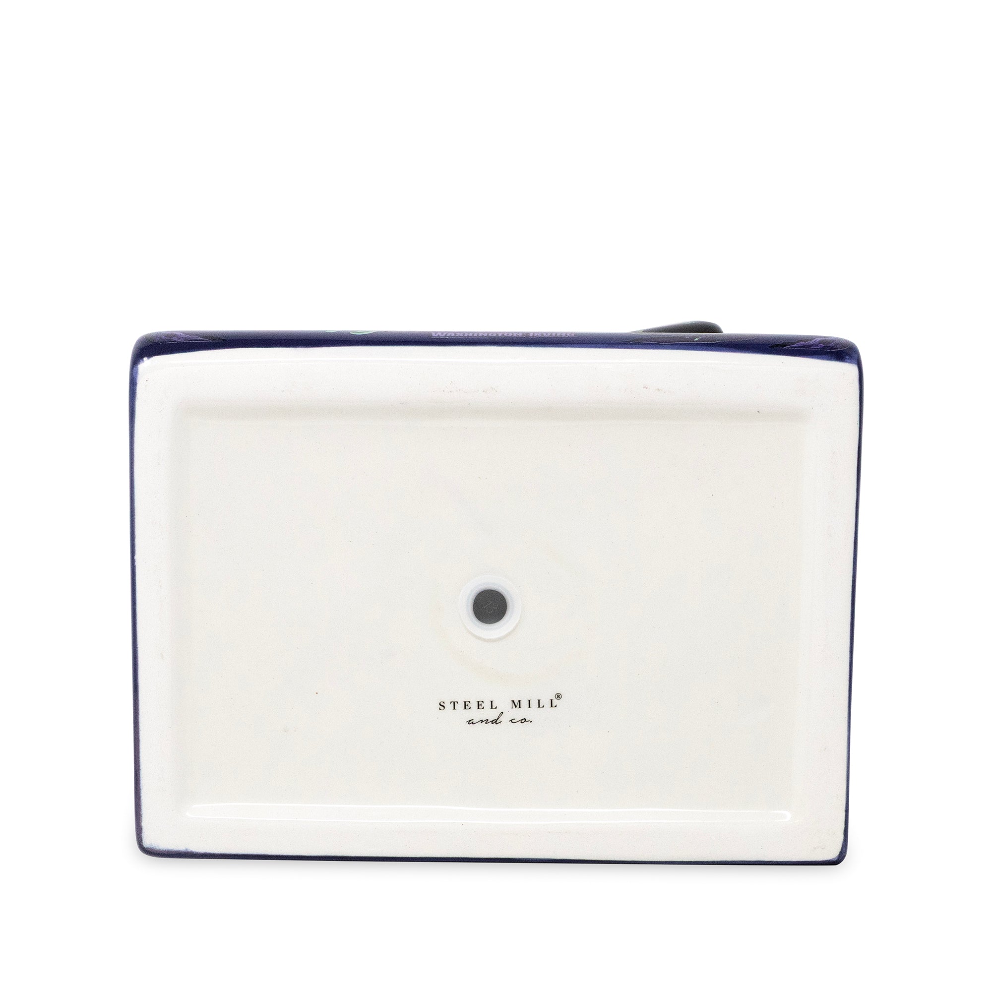 The underside of a rectangular planter, showing a dark blue rim, a central hole, and the printed brand name 'STEEL MILL and co.' on a white background.