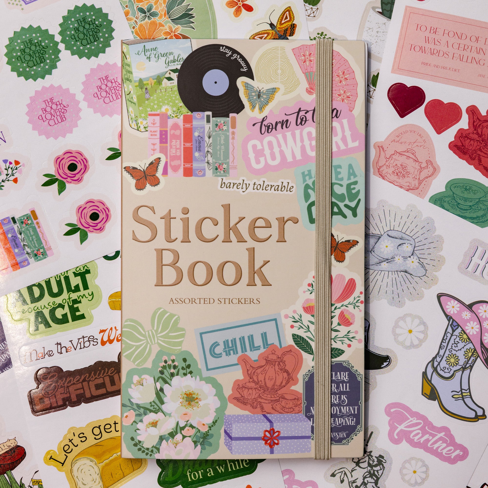 Sticker book with colorful stickers on a floral background