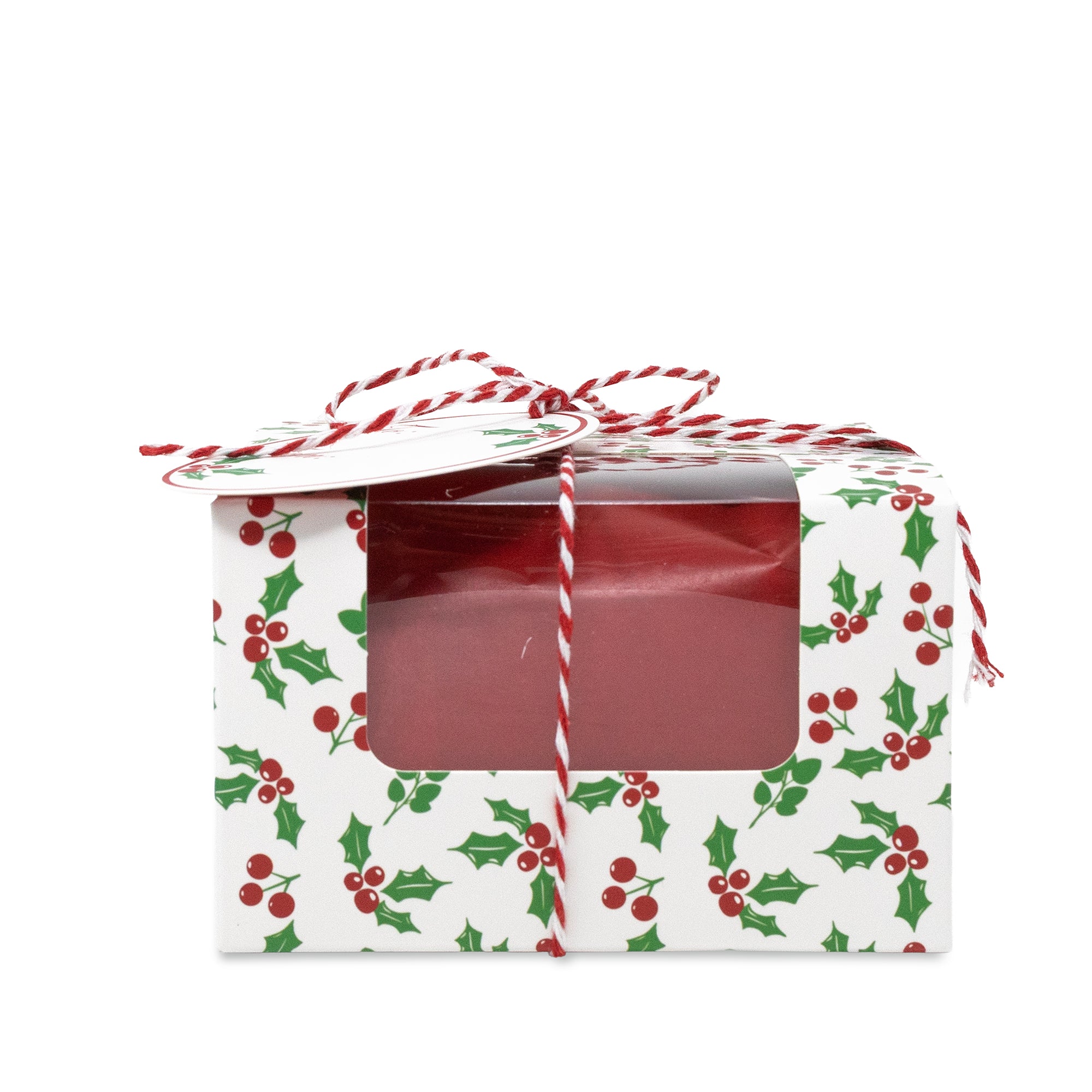 A rectangular gift box with a clear front window, wrapped in white paper printed with a green holly and red berry pattern, tied with a red-and-white striped string and topped with a matching lid.