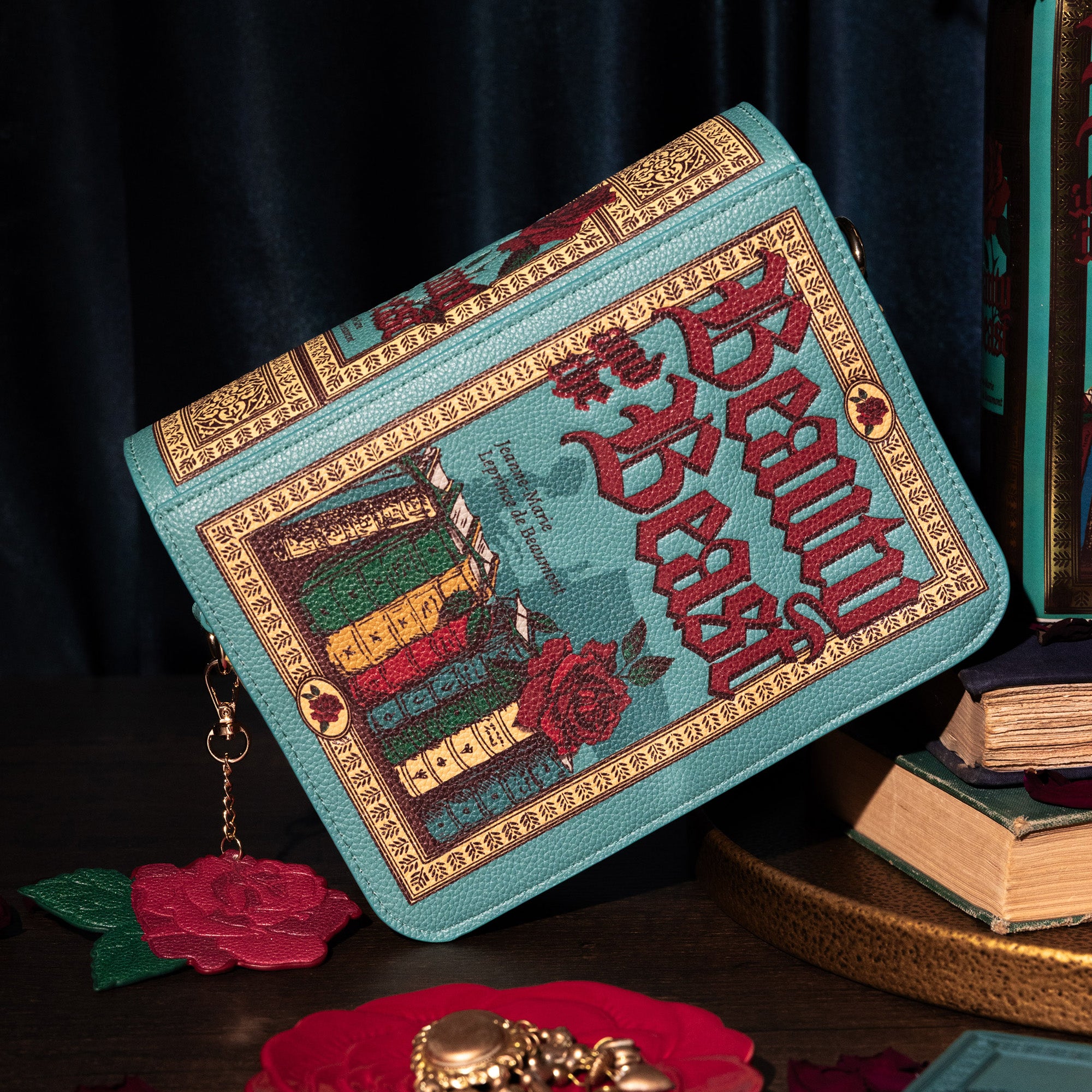Book-shaped handbag with 'Beauty and the Beast' design on a dark background