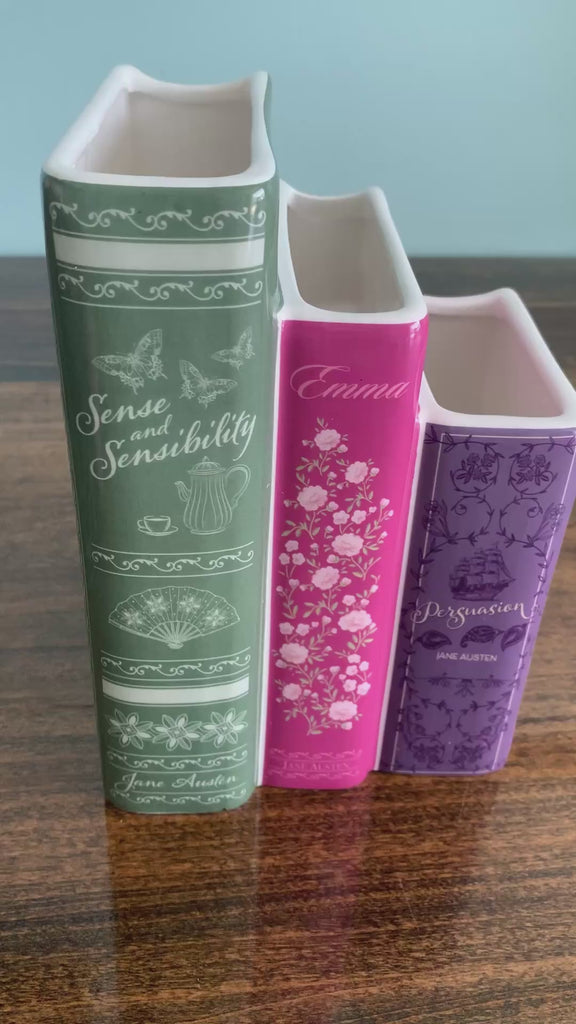 model showcasing set of three jane austen book vase