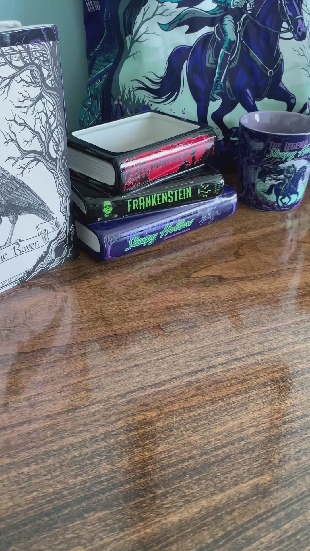 model showcasing hree gothic-themed magnets with illustrated covers