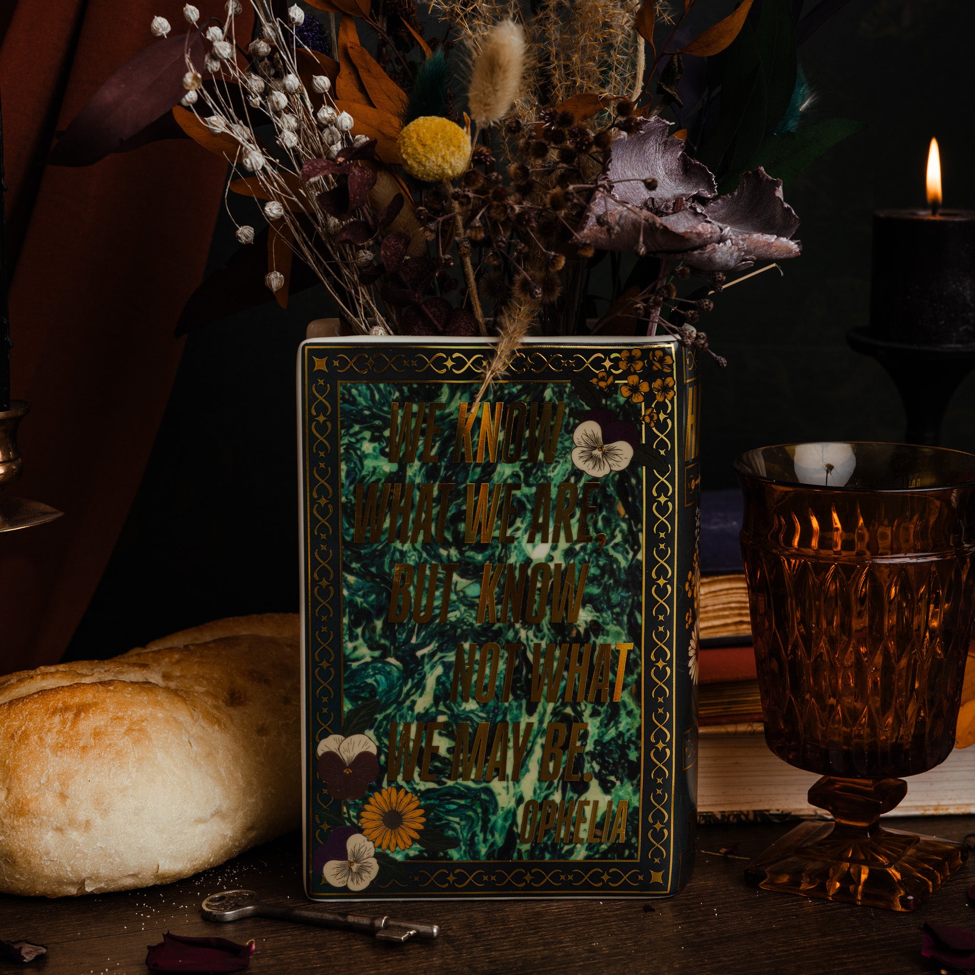 back view of black hamlet book shaped vase with dried flowers inside
